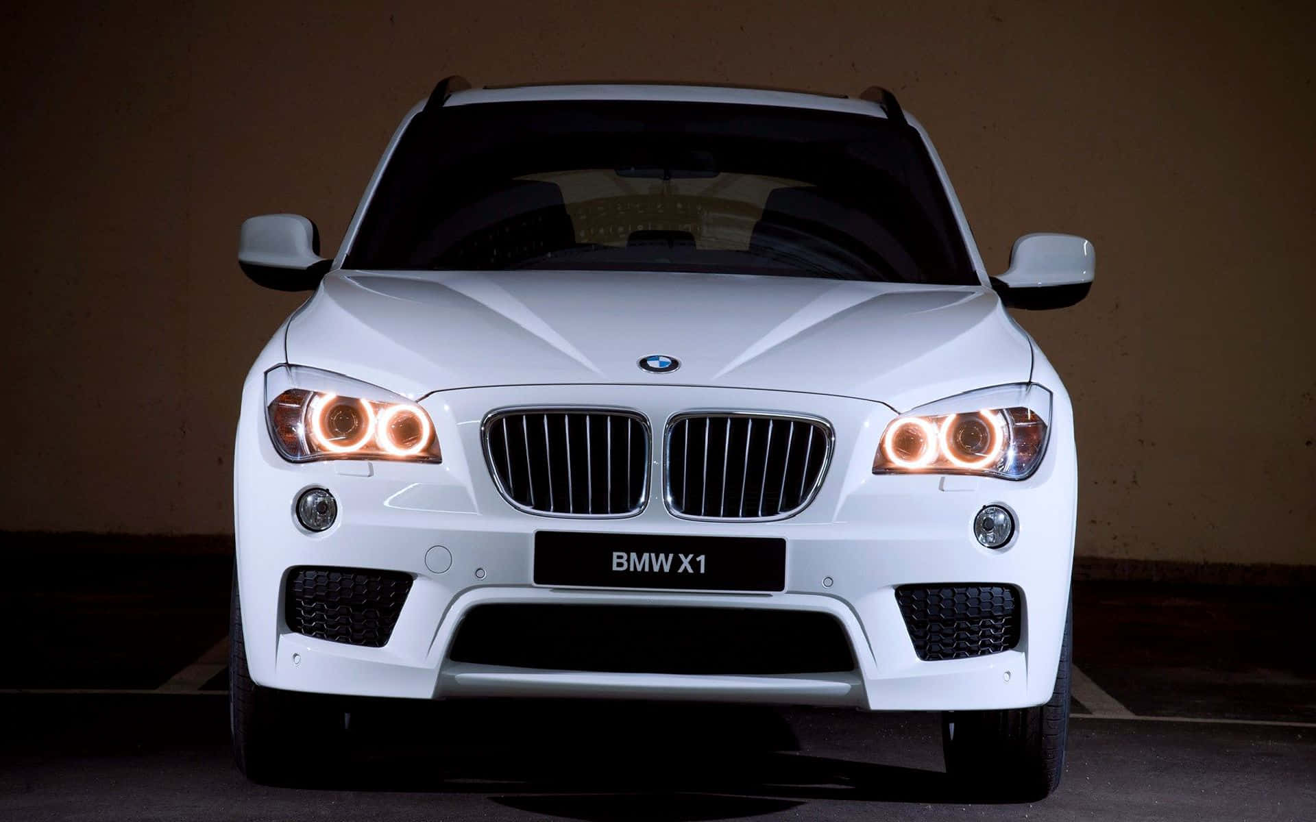 Sleek and Dynamic BMW X1 on Open Road Wallpaper