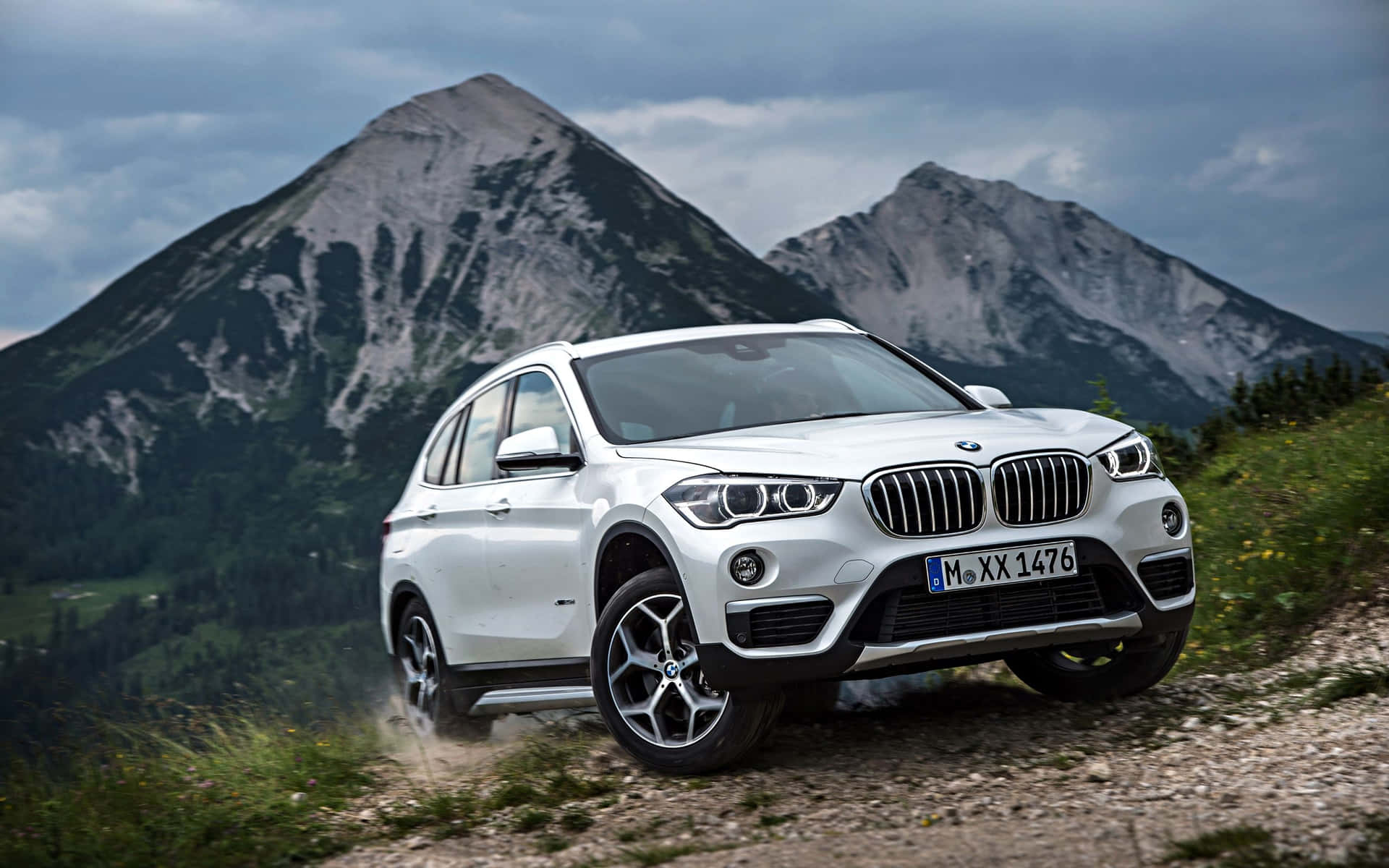 A sleek and stunning BMW X1 on the open road. Wallpaper