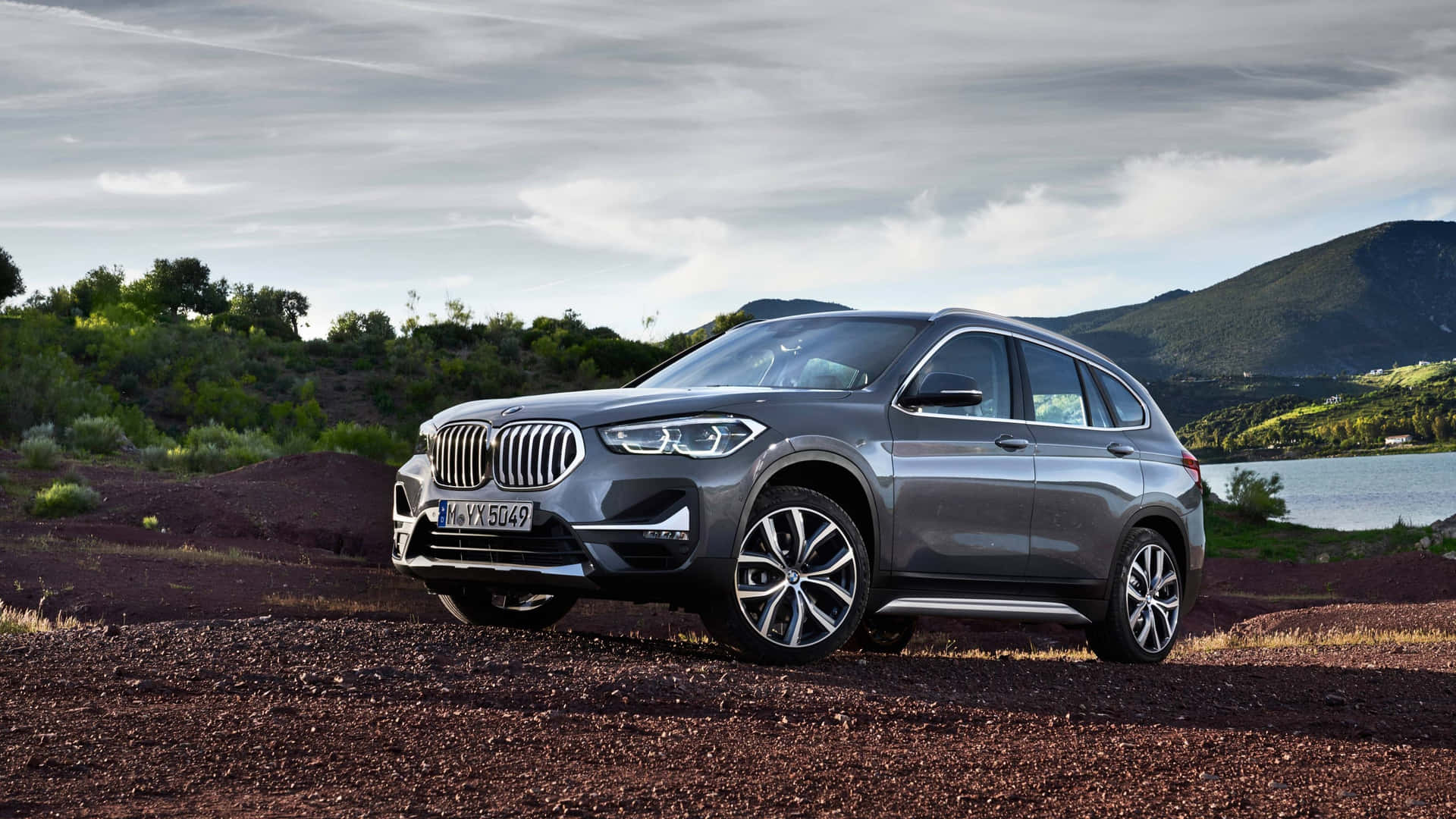 BMW X1 parked in majestic landscape Wallpaper