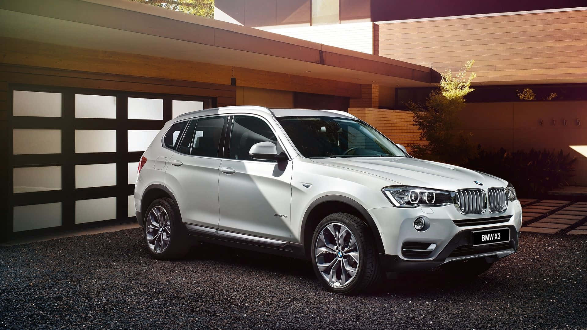 Sleek BMW X3 on a Picturesque Road Wallpaper