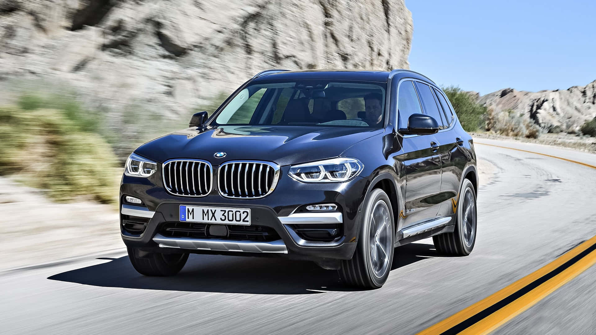 Sleek and Stylish BMW X3 on the Road Wallpaper