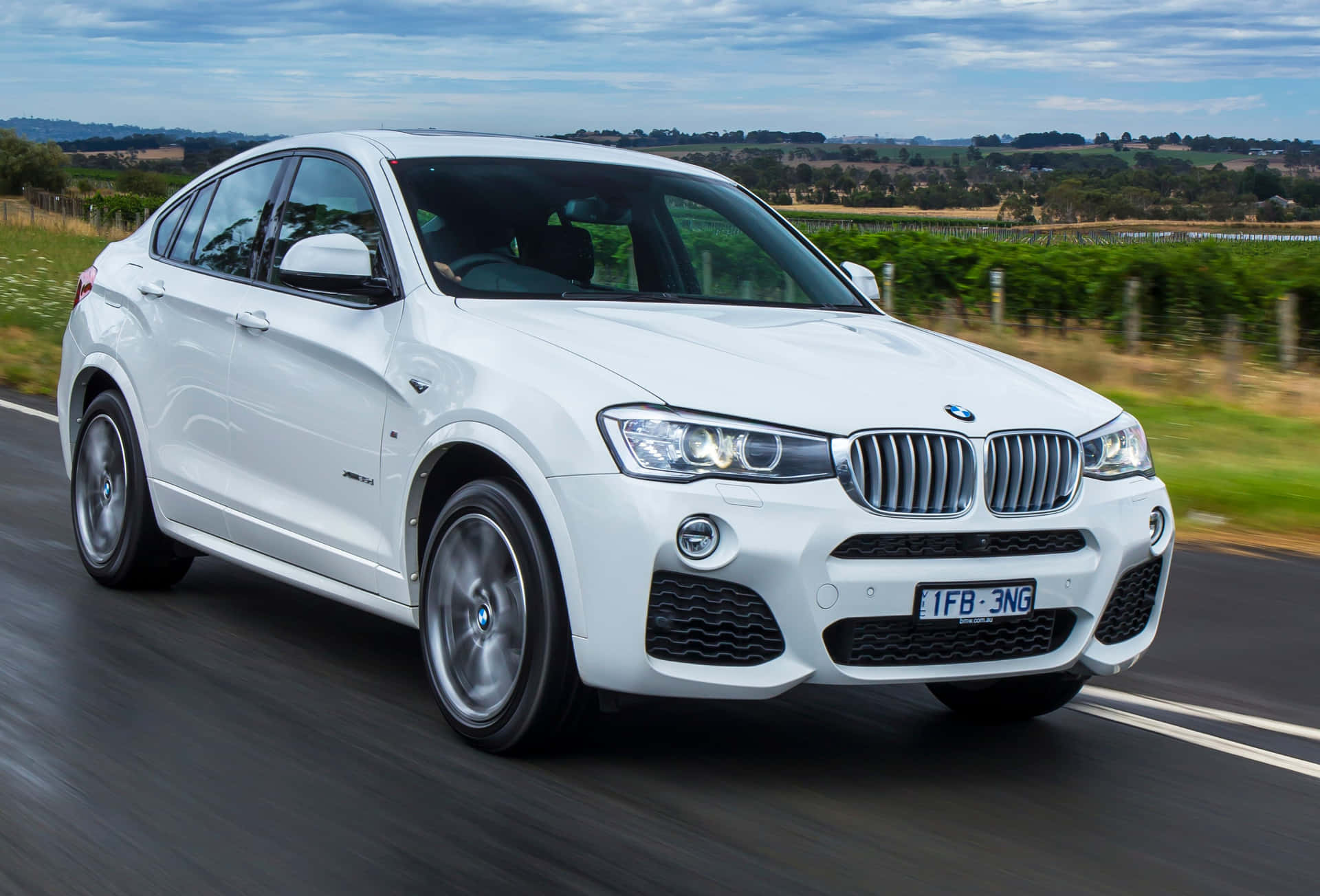 Stunning BMW X4 in action on the open road Wallpaper
