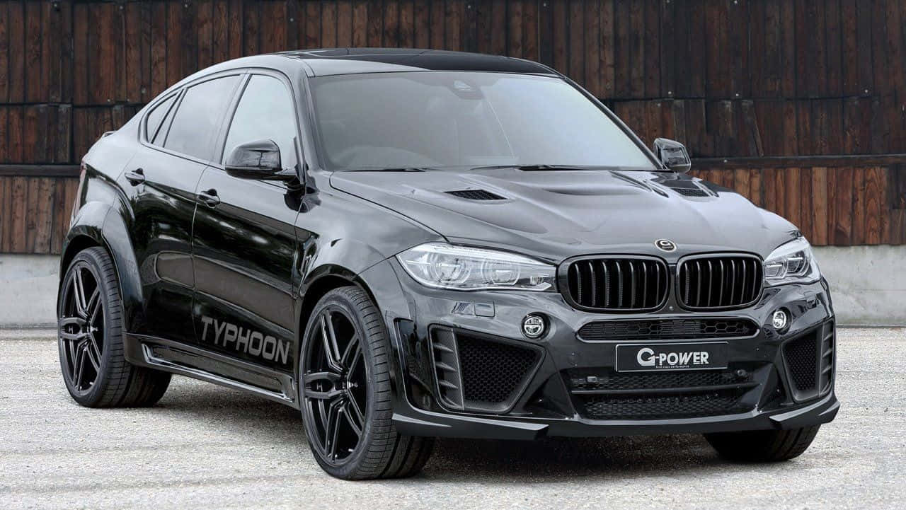 Elegantebmw X6 En Un Impresionante Entorno Al Aire Libre Fondo de pantalla