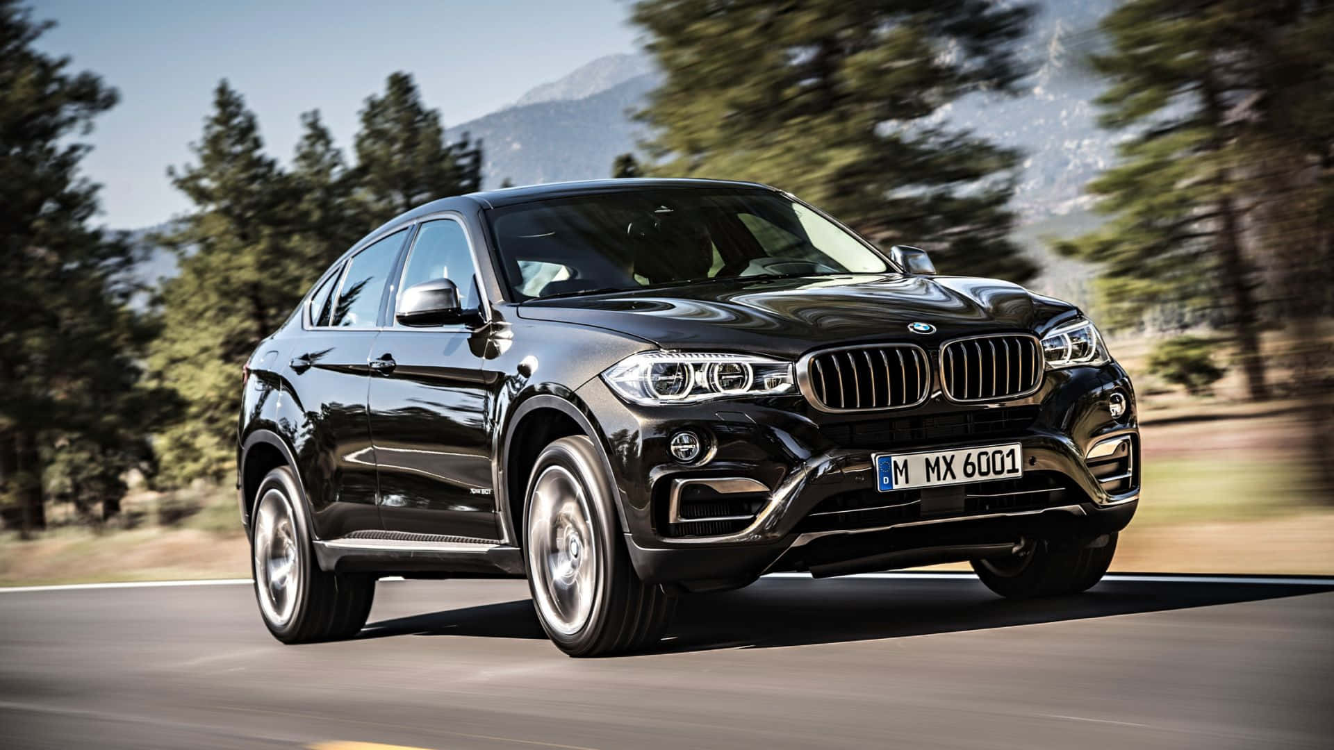 Sleek and Powerful BMW X6 on an Open Road Wallpaper