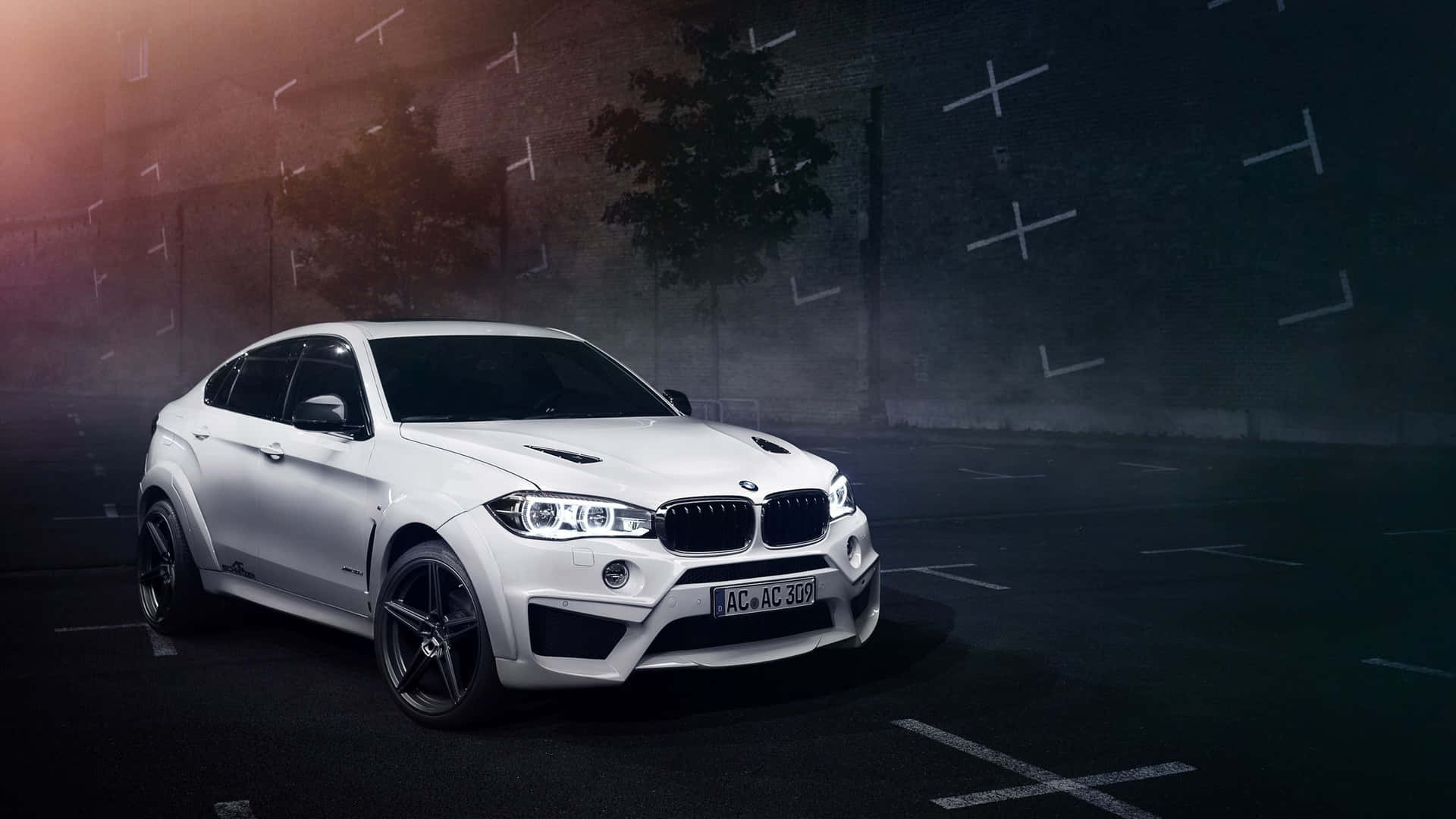 Stunning BMW X6 cruising on an open road Wallpaper