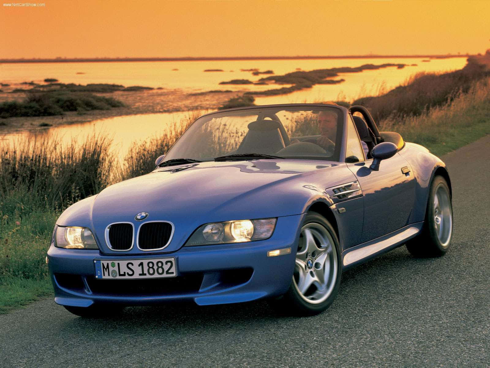Sleek BMW Z3 cruising on a scenic highway Wallpaper