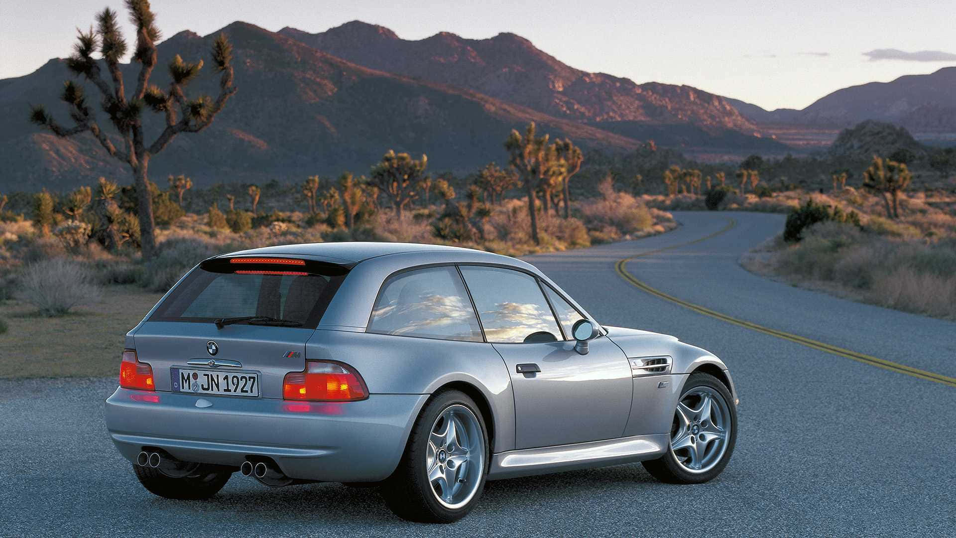 Sleek BMW Z3 Sports Roadster on the Open Road Wallpaper