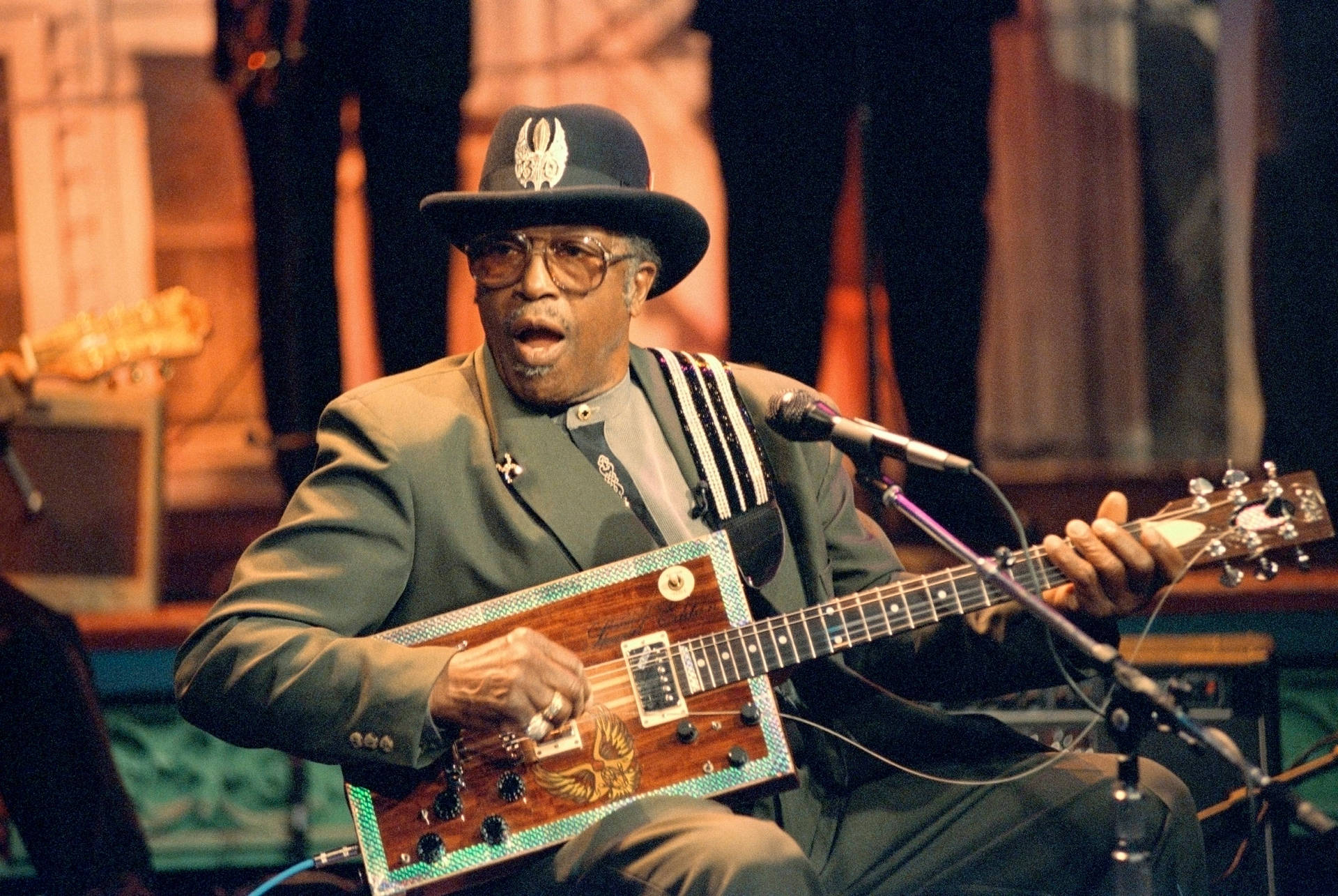 Bo Diddley Singing With Guitar Wallpaper