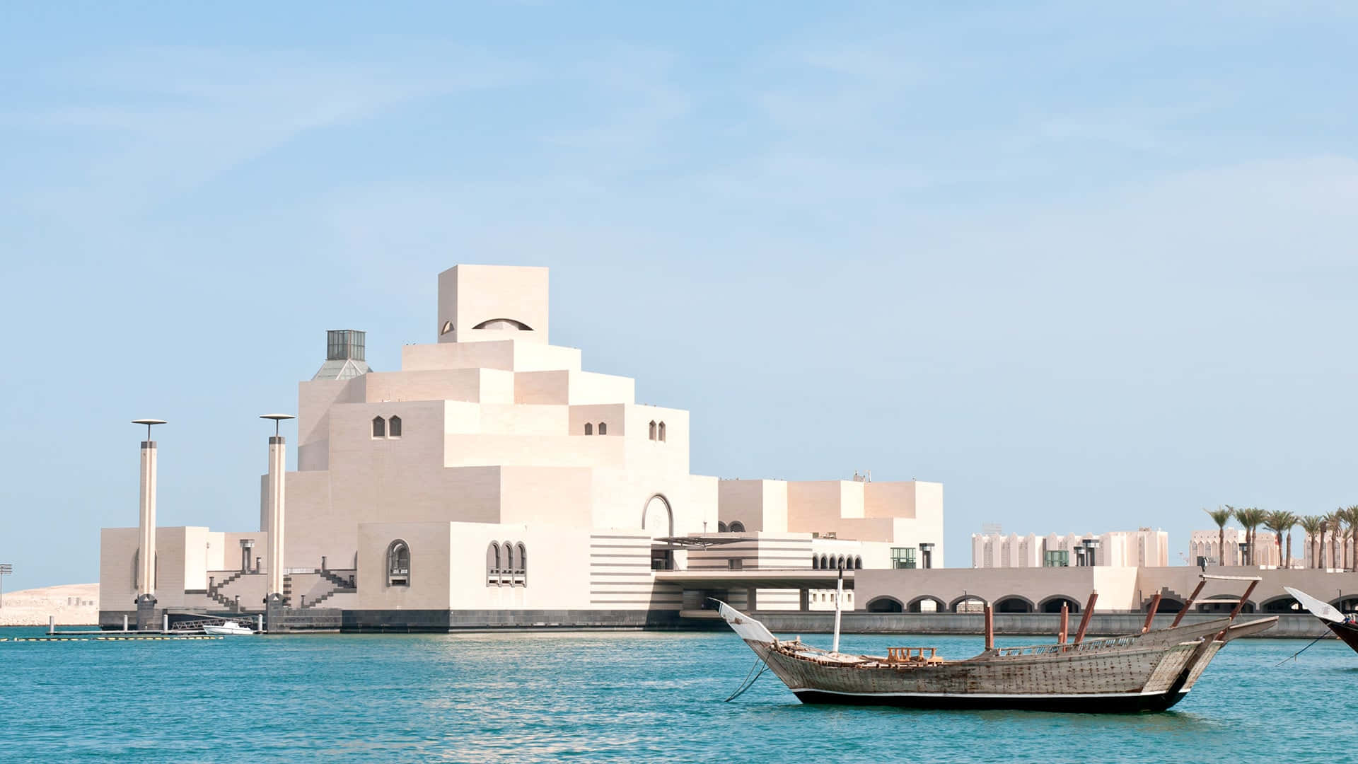 Spectacular view of boats approaching the Museum of Islamic Art Wallpaper