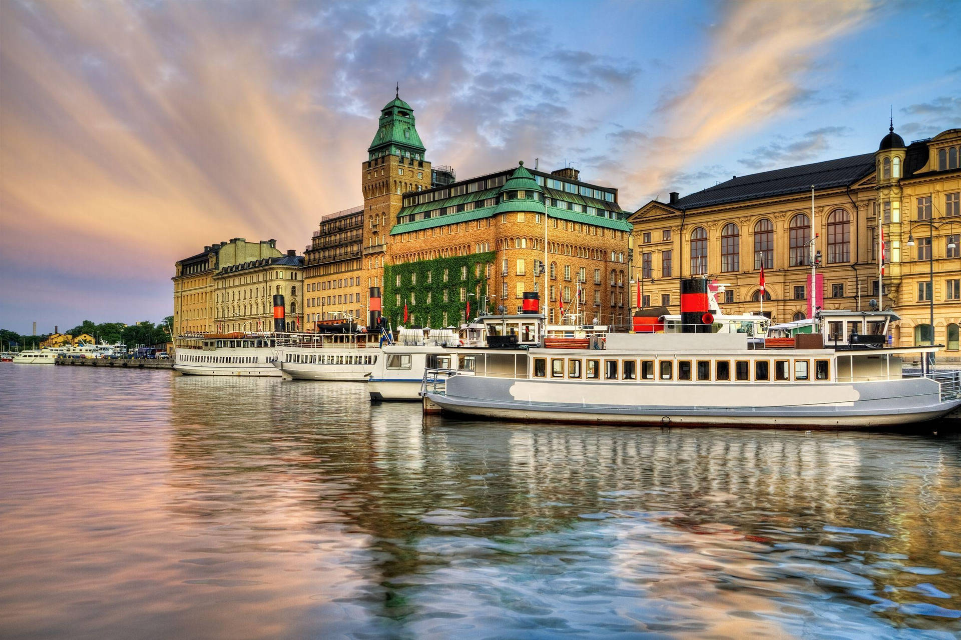Boats Docked On Stockholm Waterfront Wallpaper