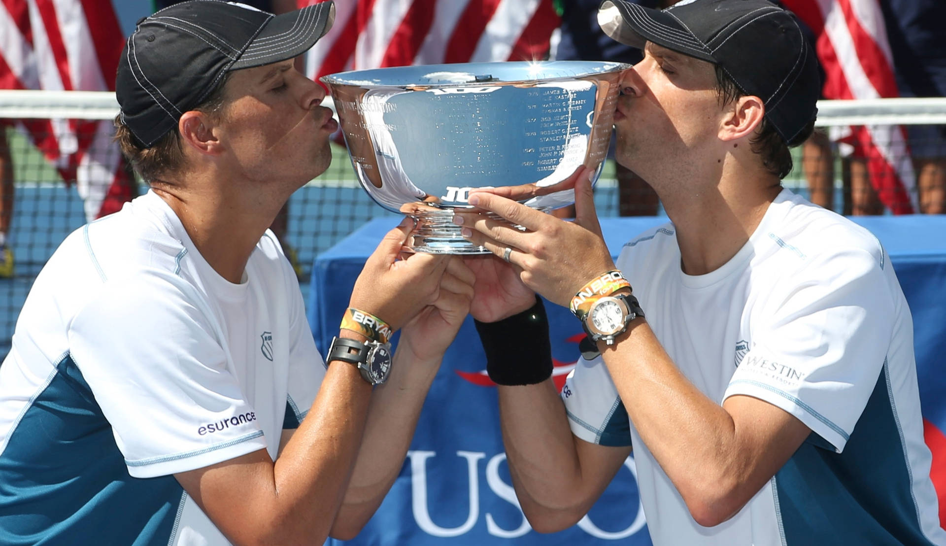 Bob Bryan Kissing Trophy With Mike Wallpaper