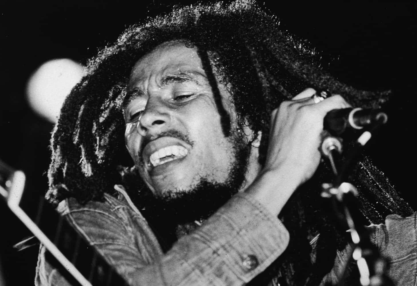 Bob Marley Singing Into A Microphone