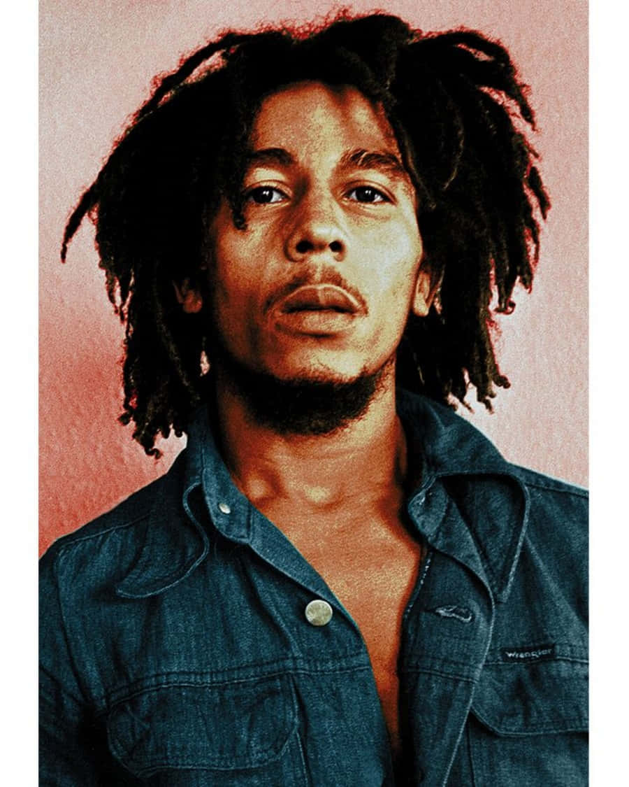 A Man With Dreadlocks Is Posing For A Photo