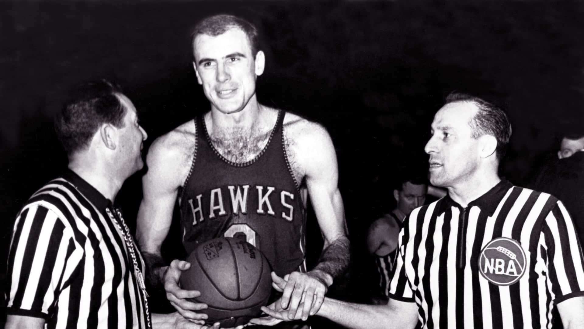 Bob Pettit With Two Referees Wallpaper