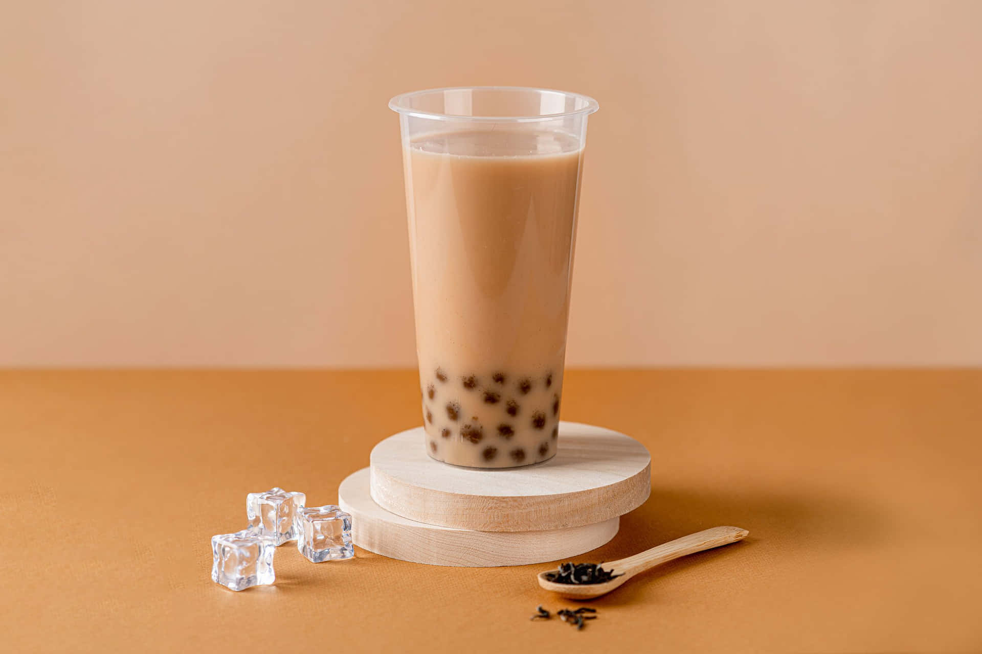 A Cup Of Bubble Tea With A Spoon And Ice