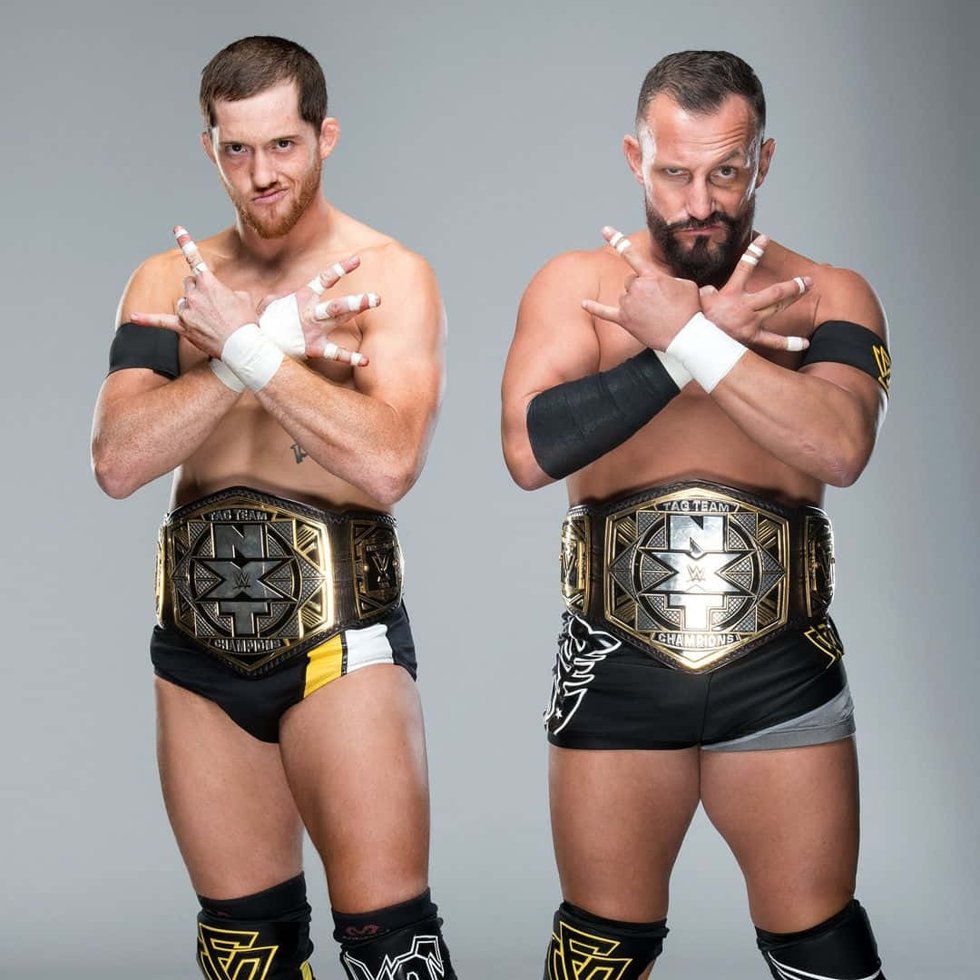 Professional Wrestling Stars Bobby Fish and Kyle O'Reilly in an Action-Packed Photoshoot Wallpaper