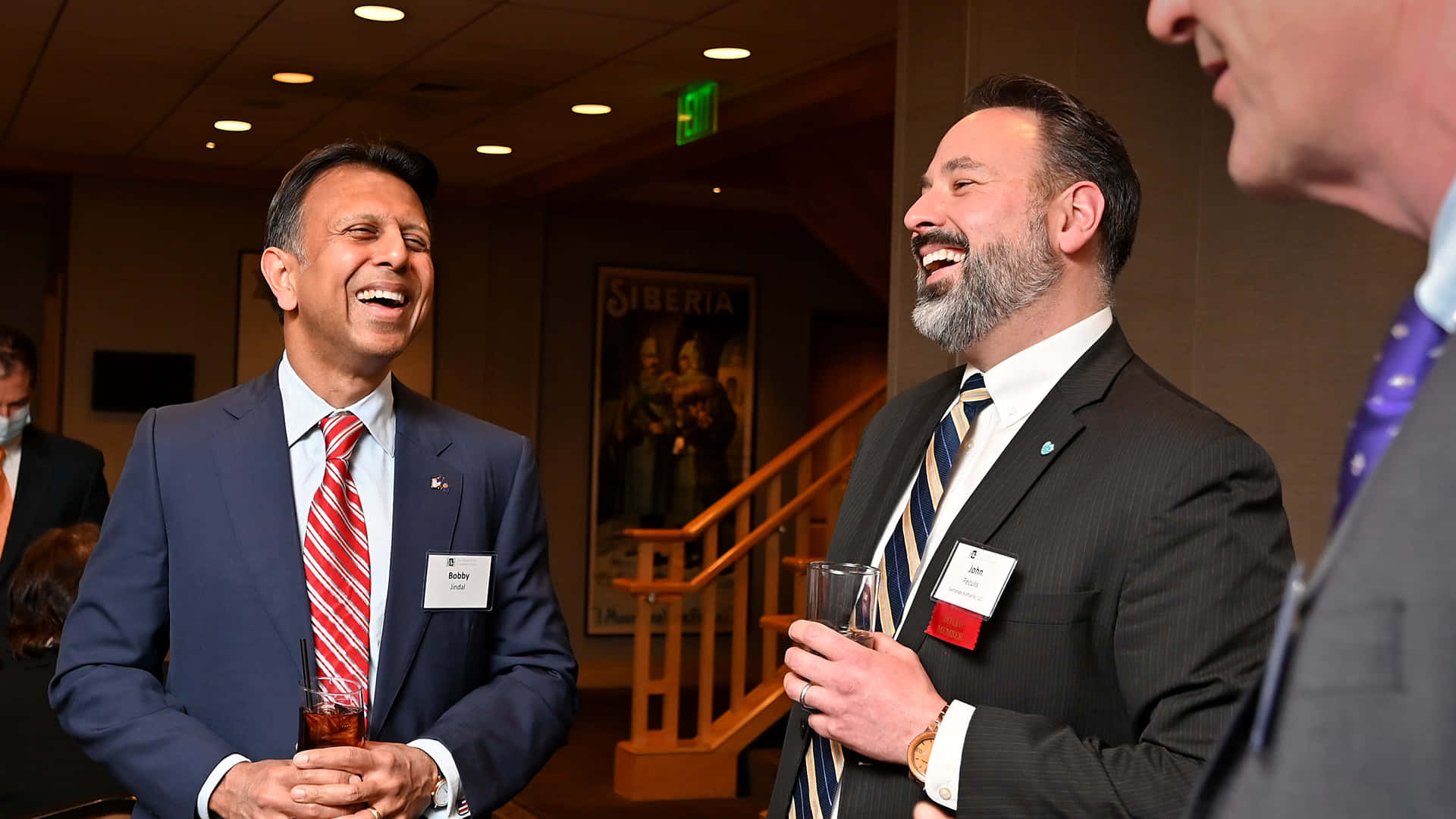 Louisiana Governor Bobby Jindal Sharing a Laugh with Other Governors Wallpaper