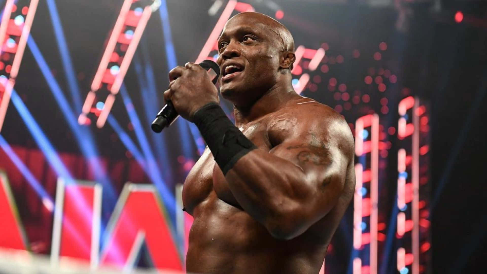 Bobby Lashley Holding A Microphone Wallpaper