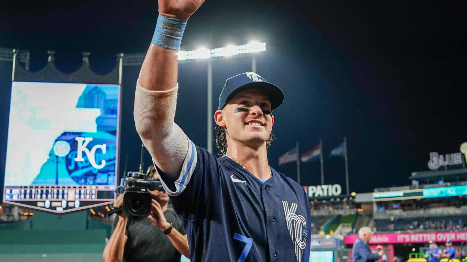 Bobby Witt Jr Celebrating Victoryat Night Game Wallpaper