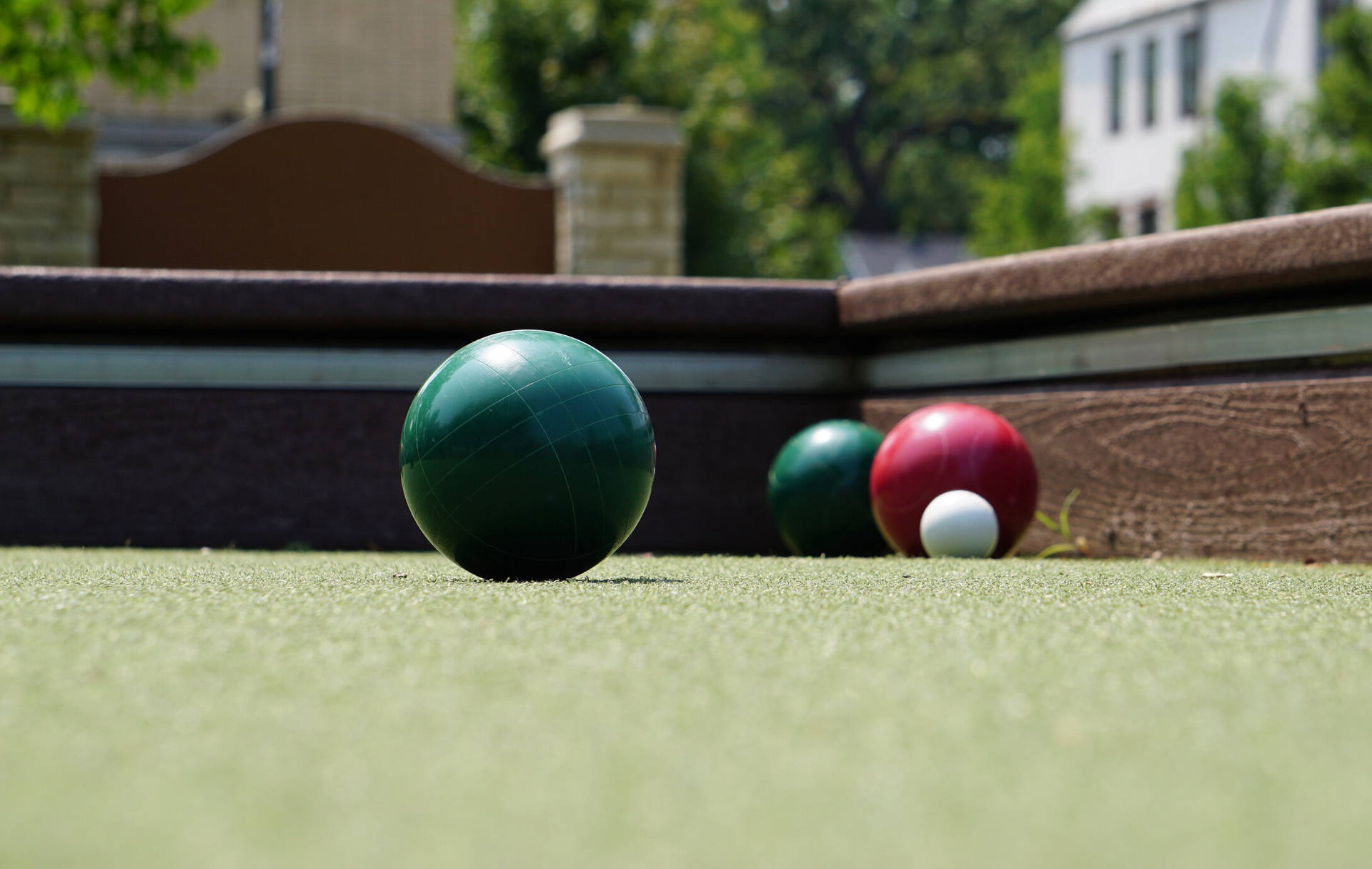Bocce Ball Green And Red On Court Wallpaper