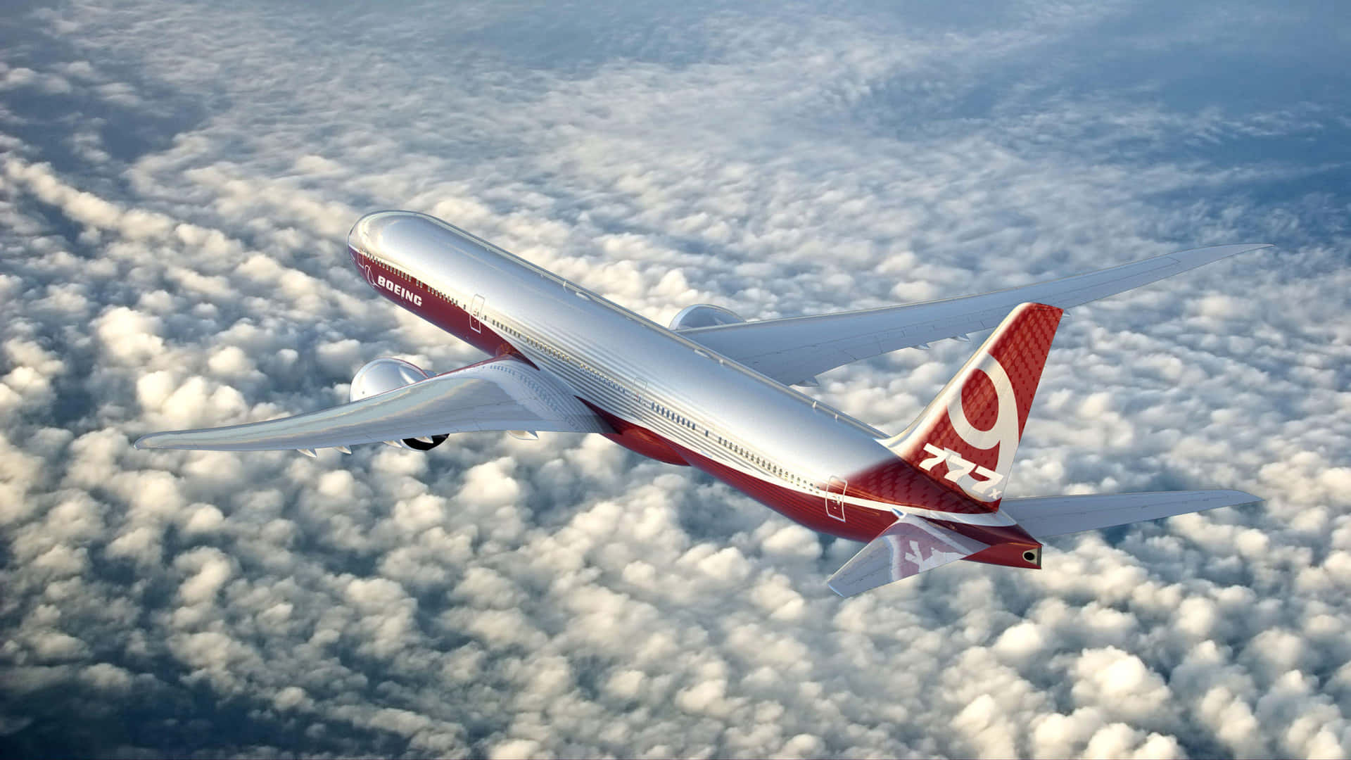 Boeing777 Flying Above Clouds Wallpaper