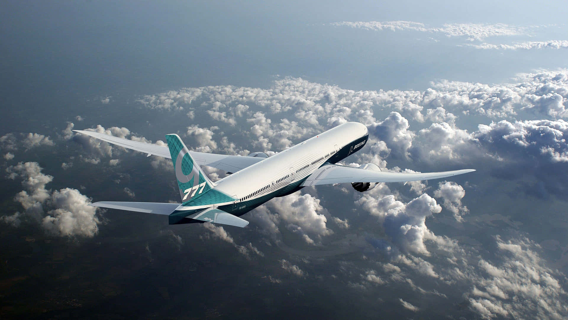 Boeing777 In Flight Over Clouds Wallpaper