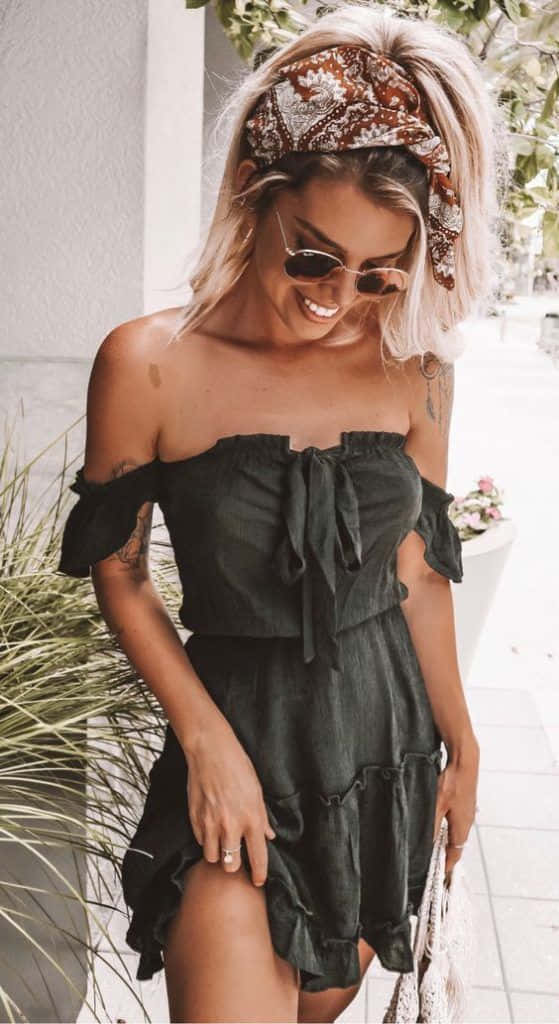 A Woman In A Green Off The Shoulder Dress