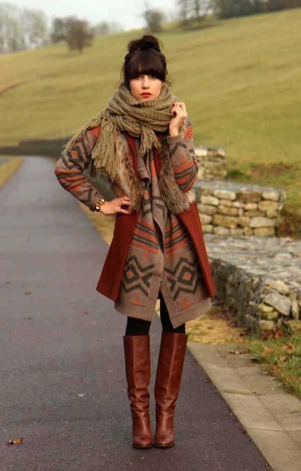 A Woman Wearing A Scarf And Boots On A Path