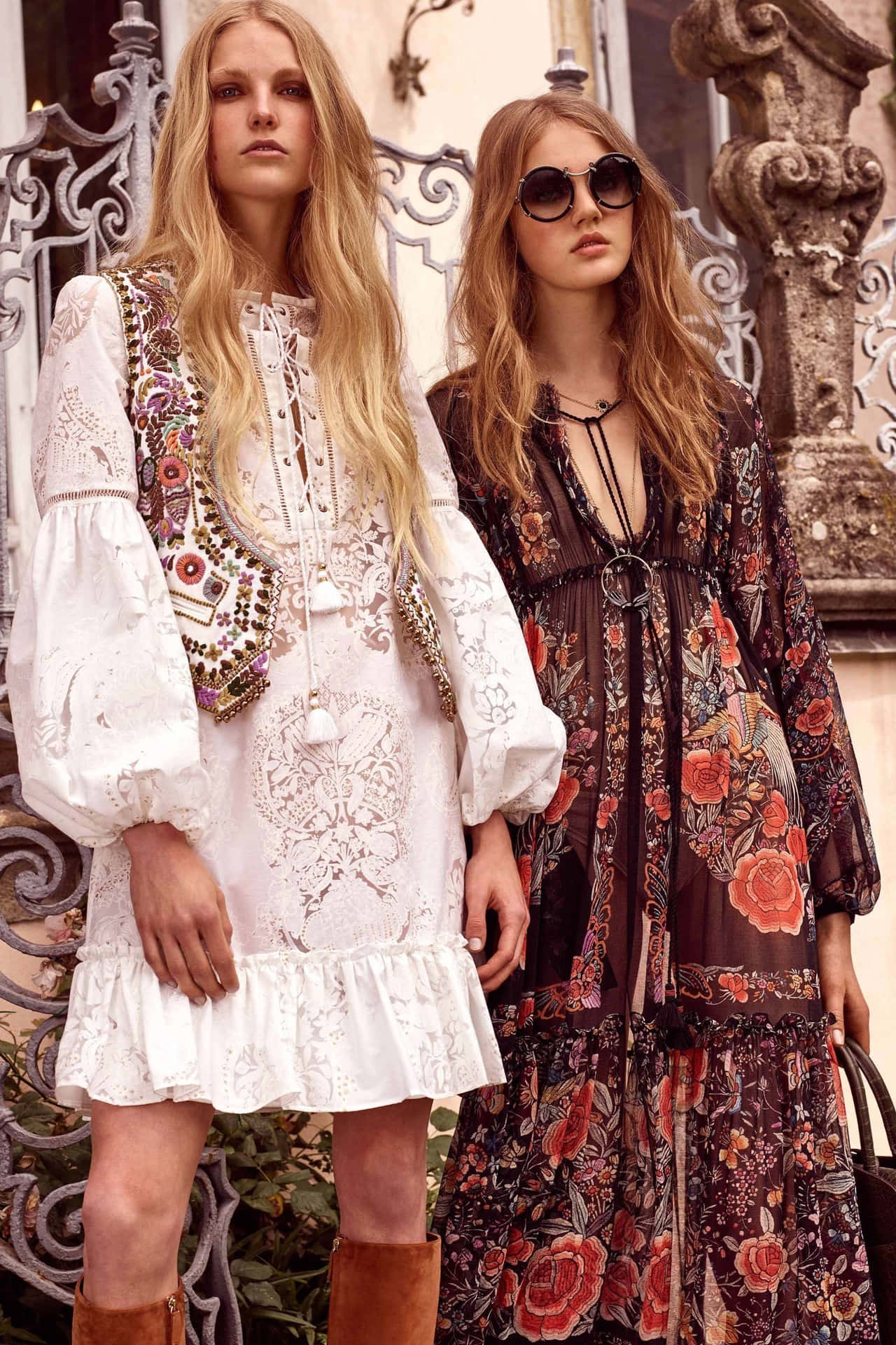 Two Women In Floral Dresses Standing Next To Each Other