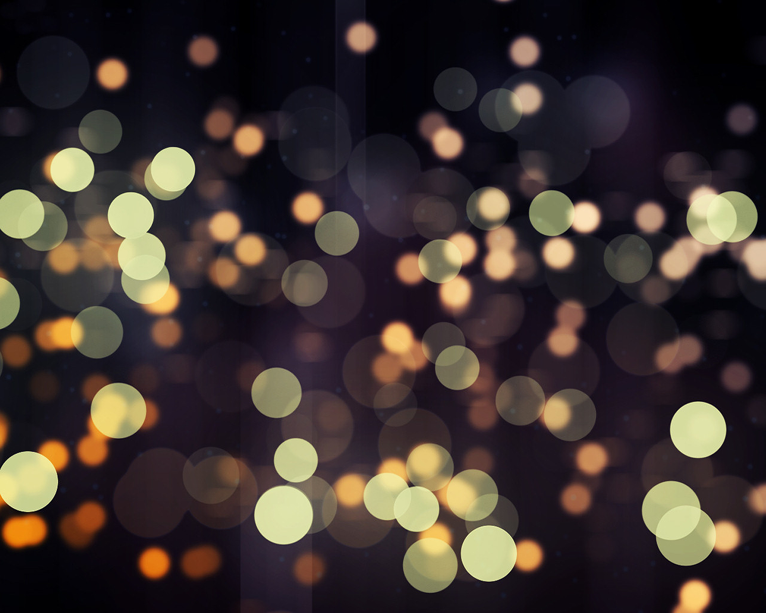 Image Colorful Bokeh Lights in the Night Sky Background — Soft glowing orbs of gold and green float against a dark velvety background creating a dreamy bokeh effect.