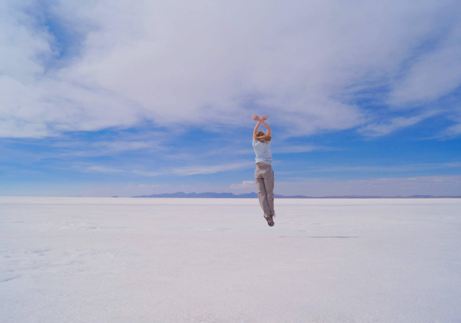 Bolivia Girl Jumping On Salt Plains