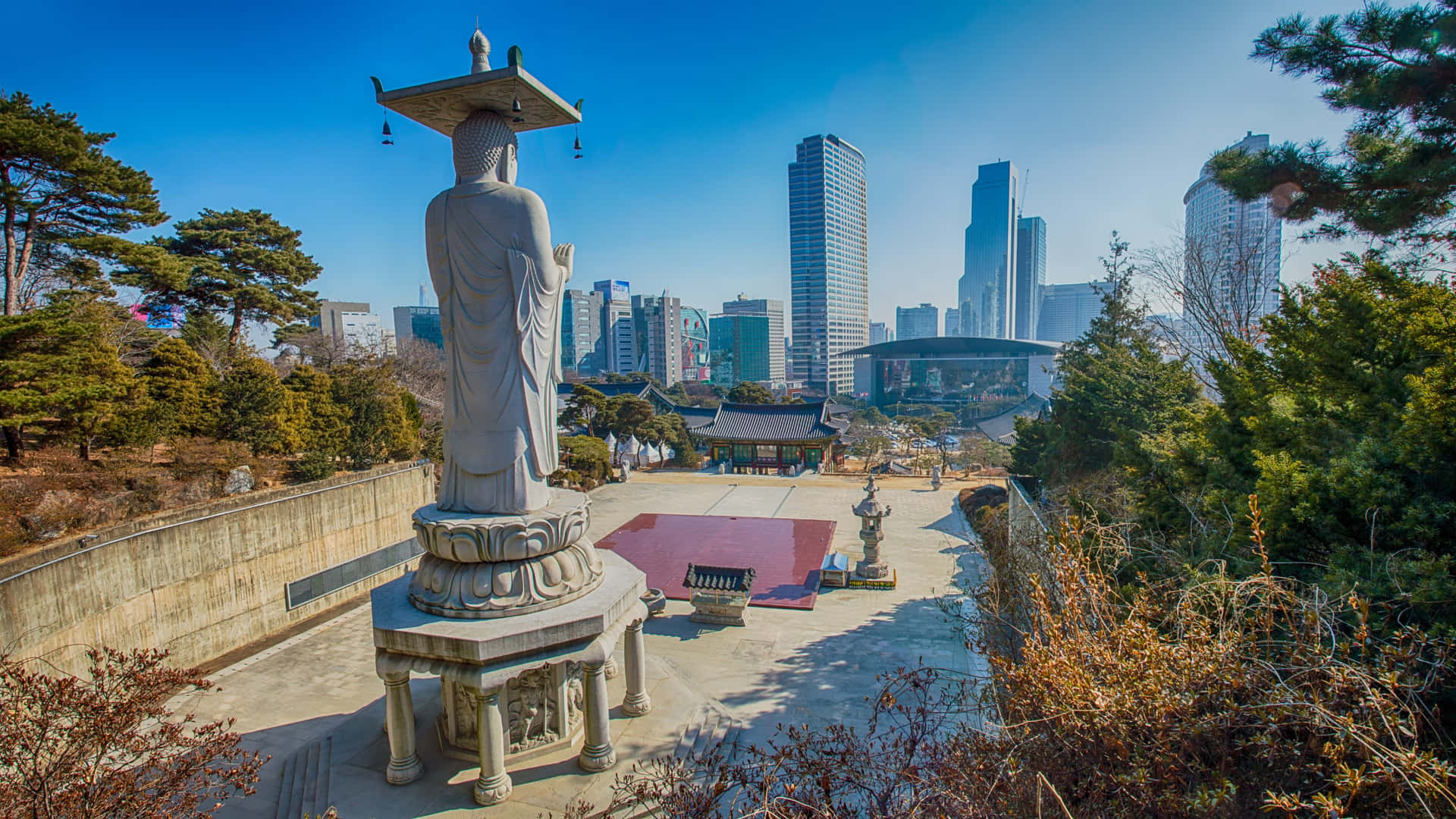 Bongeunsa Temple Statuewith Seoul Skyline Wallpaper