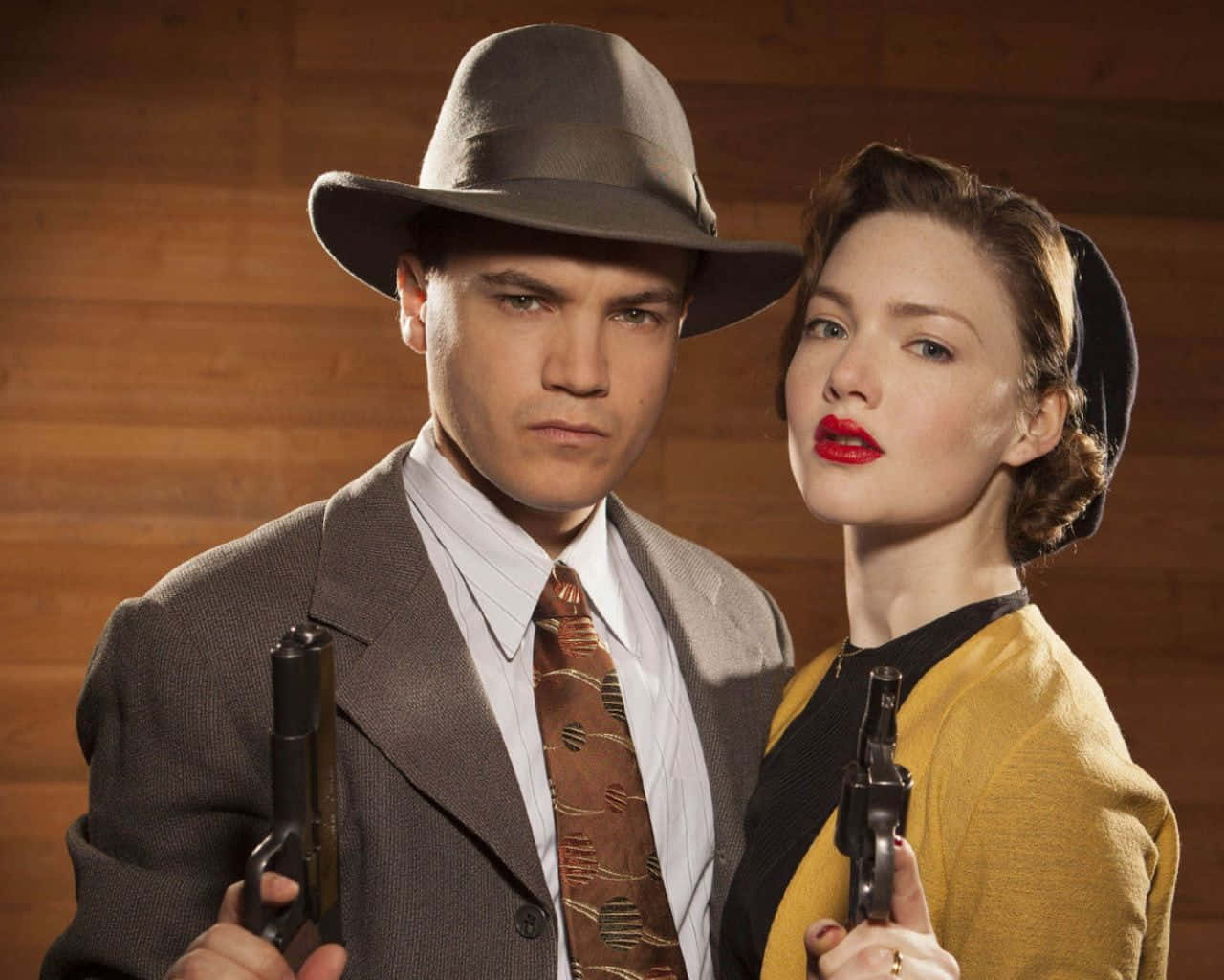 "The famous gangsters Bonnie and Clyde eluding authorities in the 1930s."