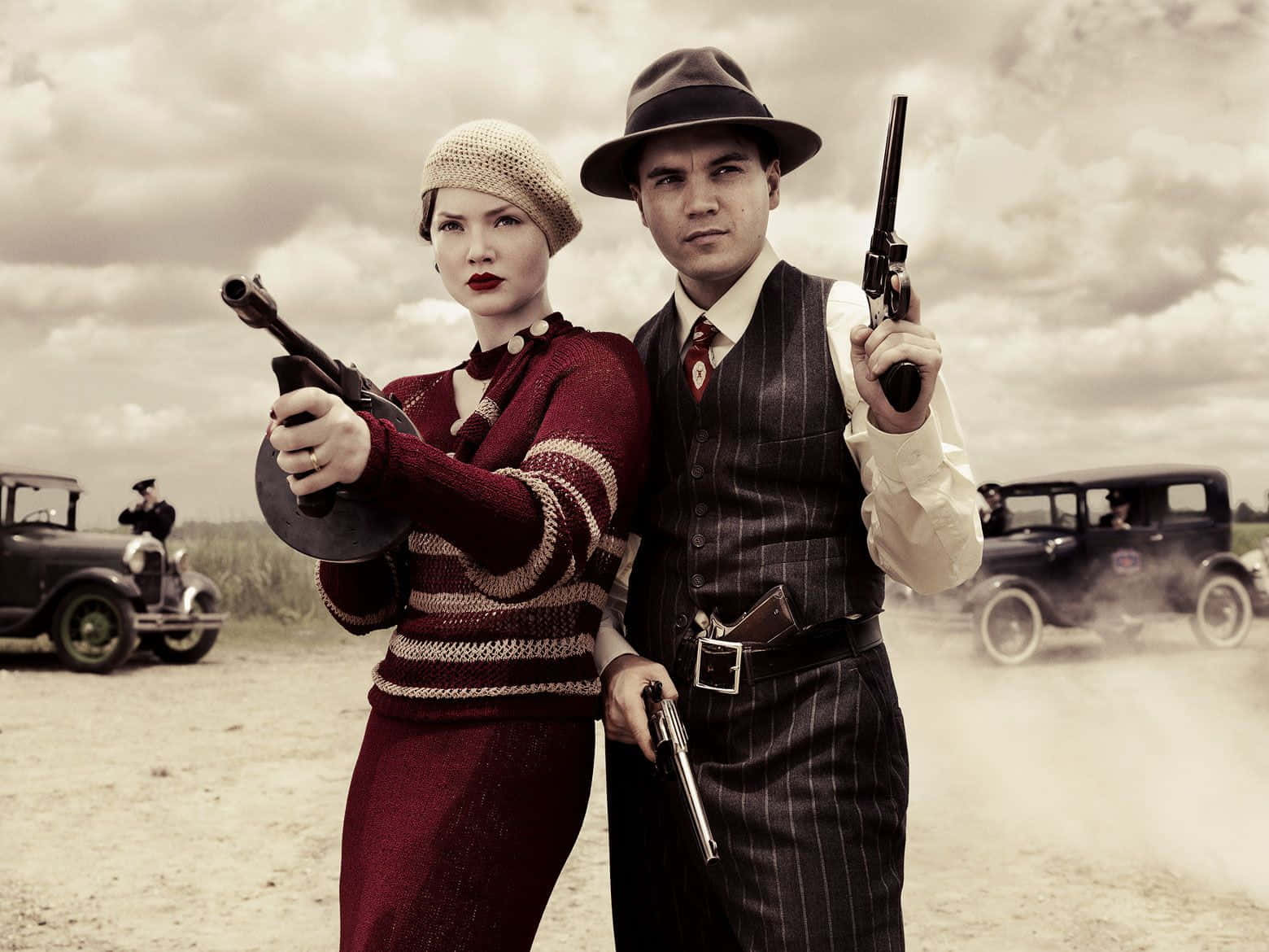 A Man And Woman In Vintage Clothing Holding Guns
