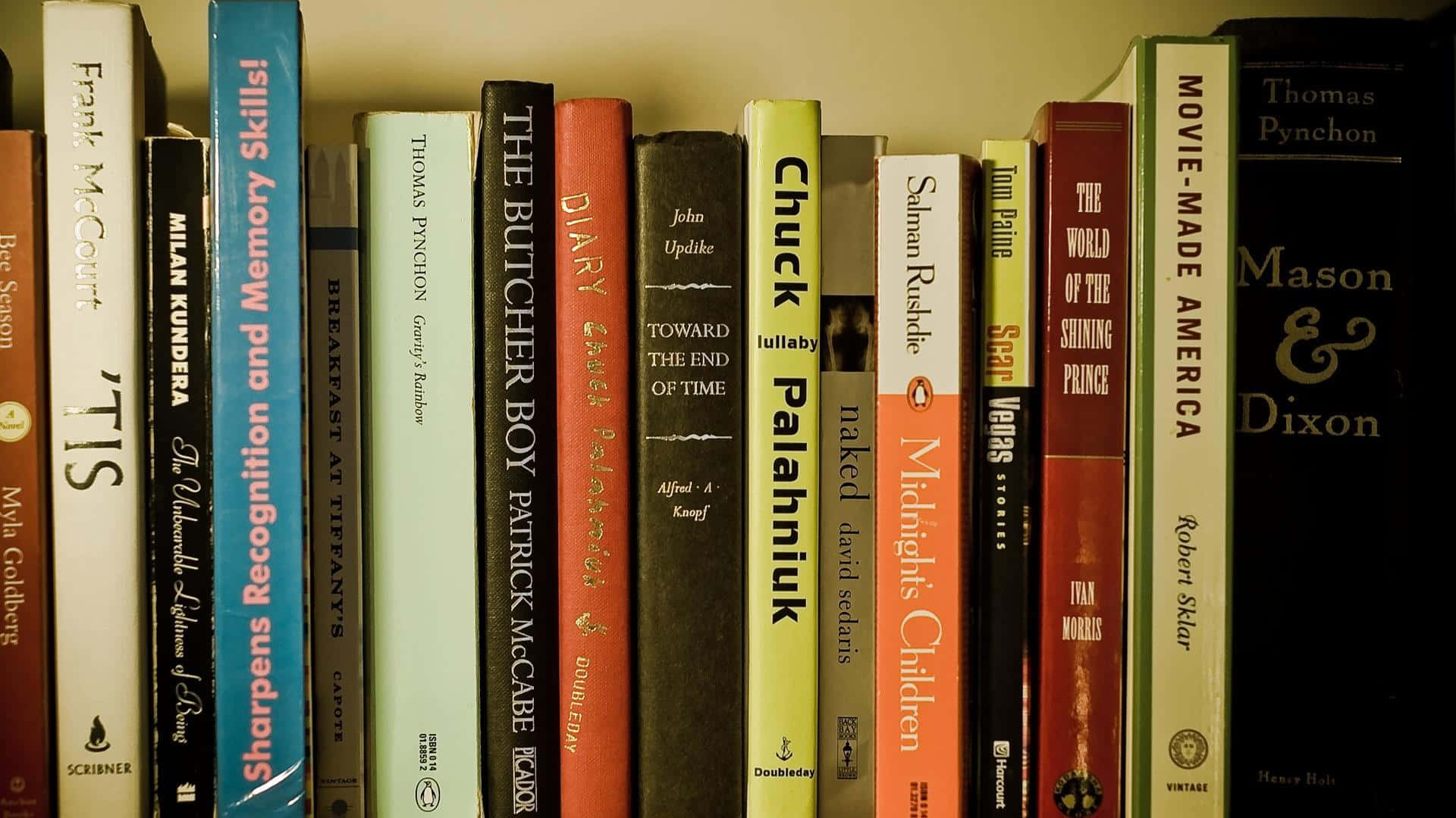 A Stack Of Books On A Shelf