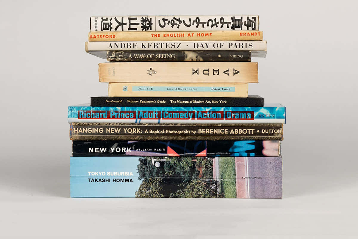A Stack Of Books With A Chinese Character On Top