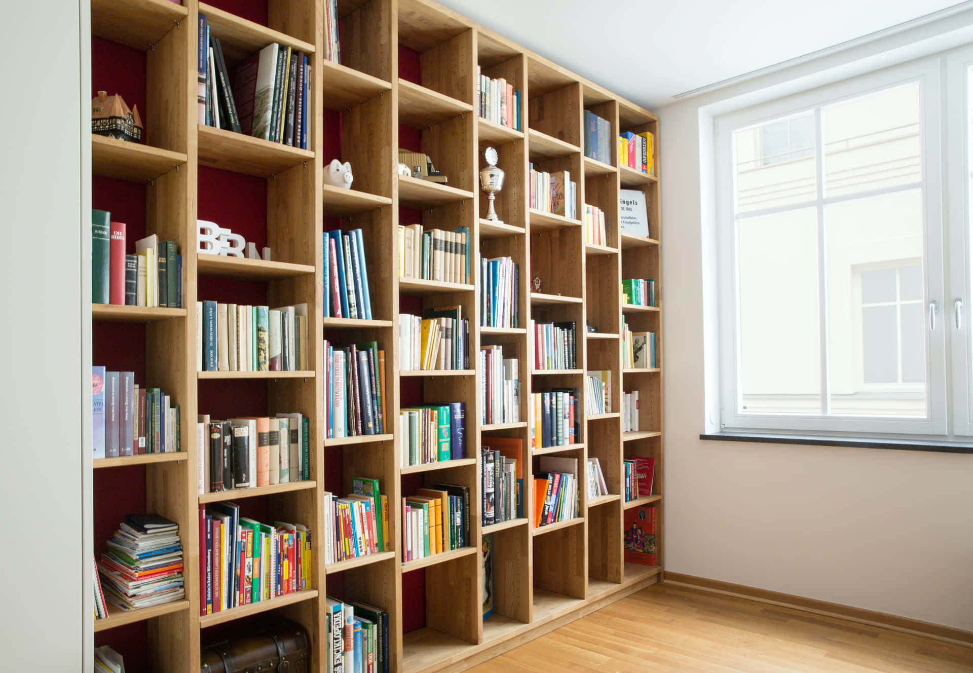 A Wooden Bookcase With Books On It