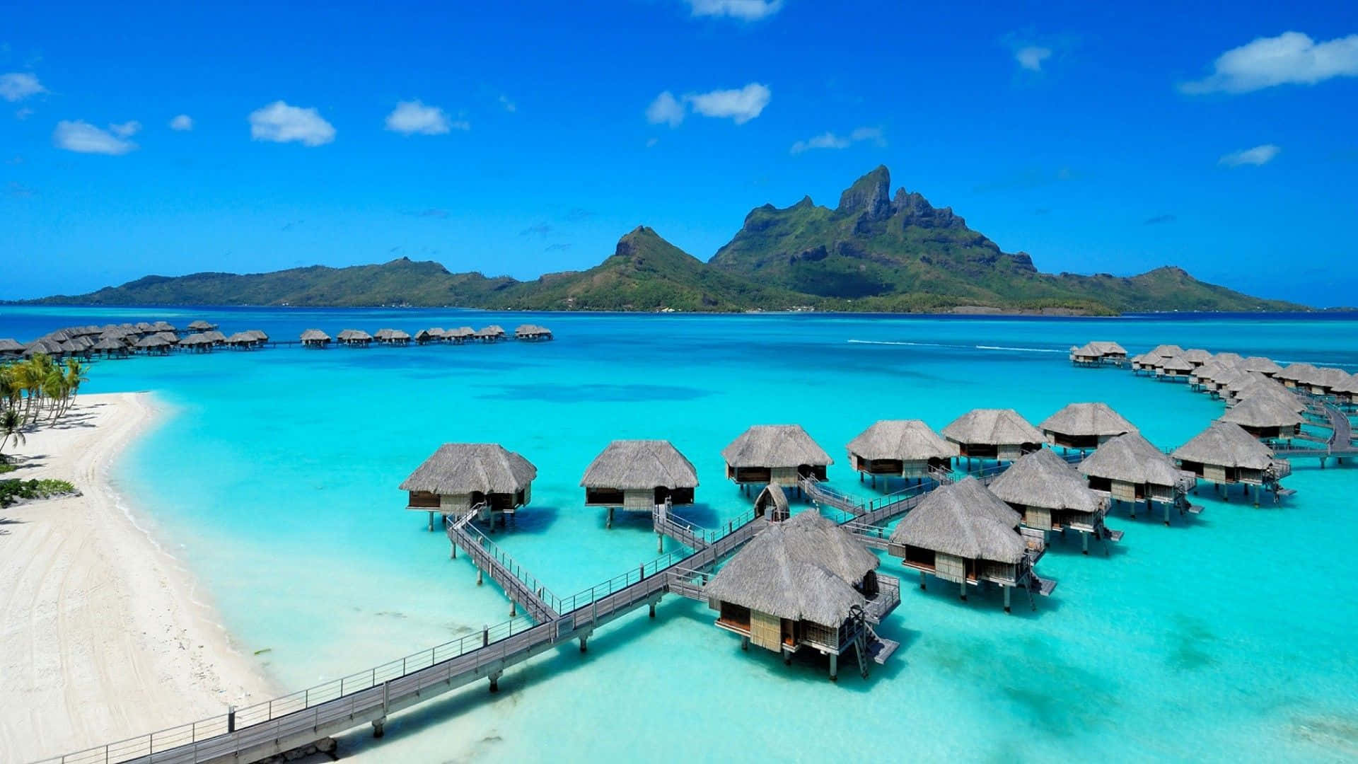 Relax and unwind in paradise - Wake up to perfect sunrises on the beach in Bora Bora. Wallpaper