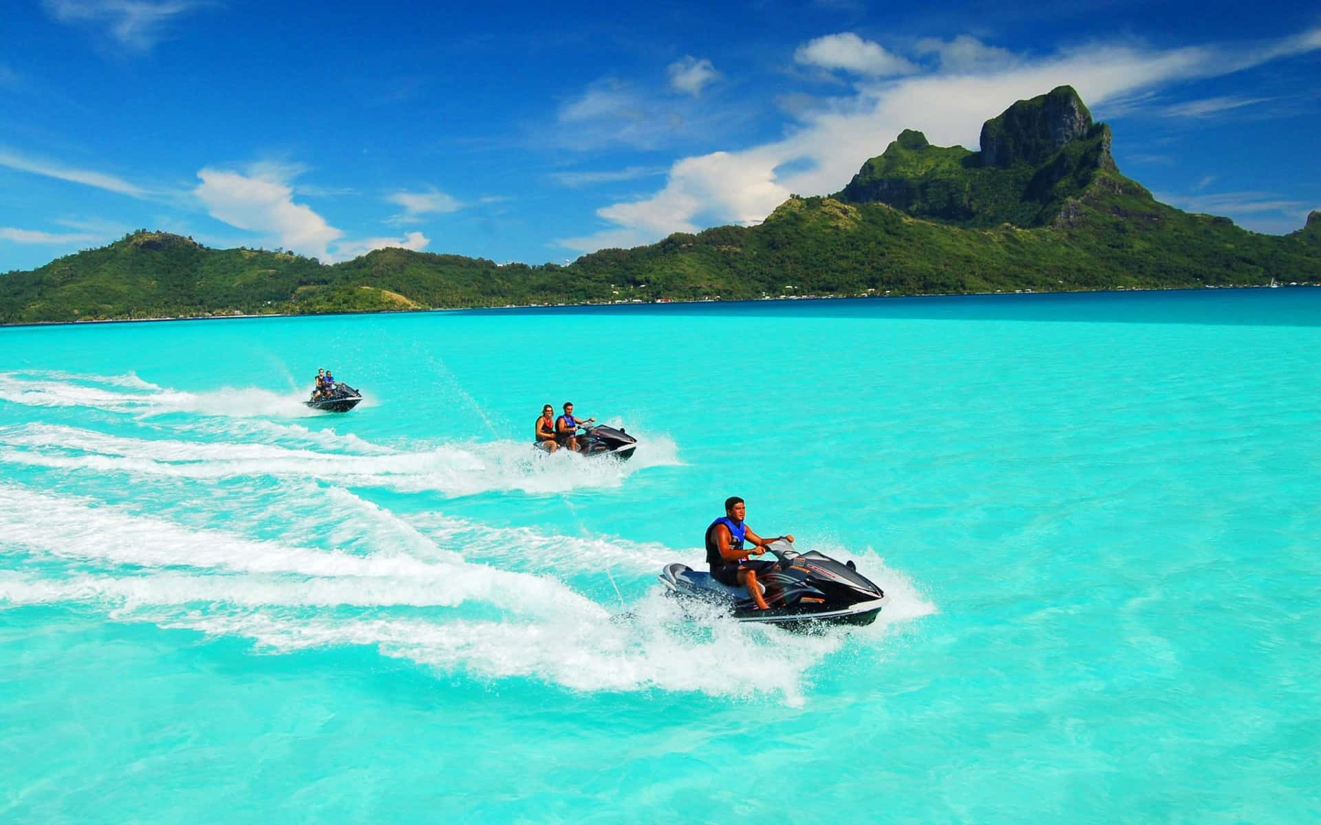 Beautiful turquoise blue lagoon surrounding the lush green, jungle-covered islands of Bora Bora" Wallpaper