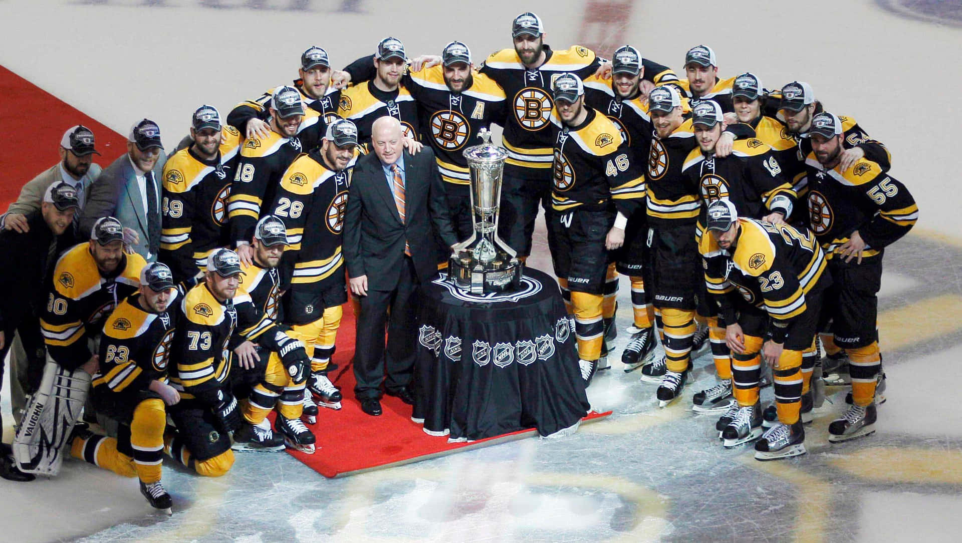 The Boston Bruins Team Pose With The Cup
