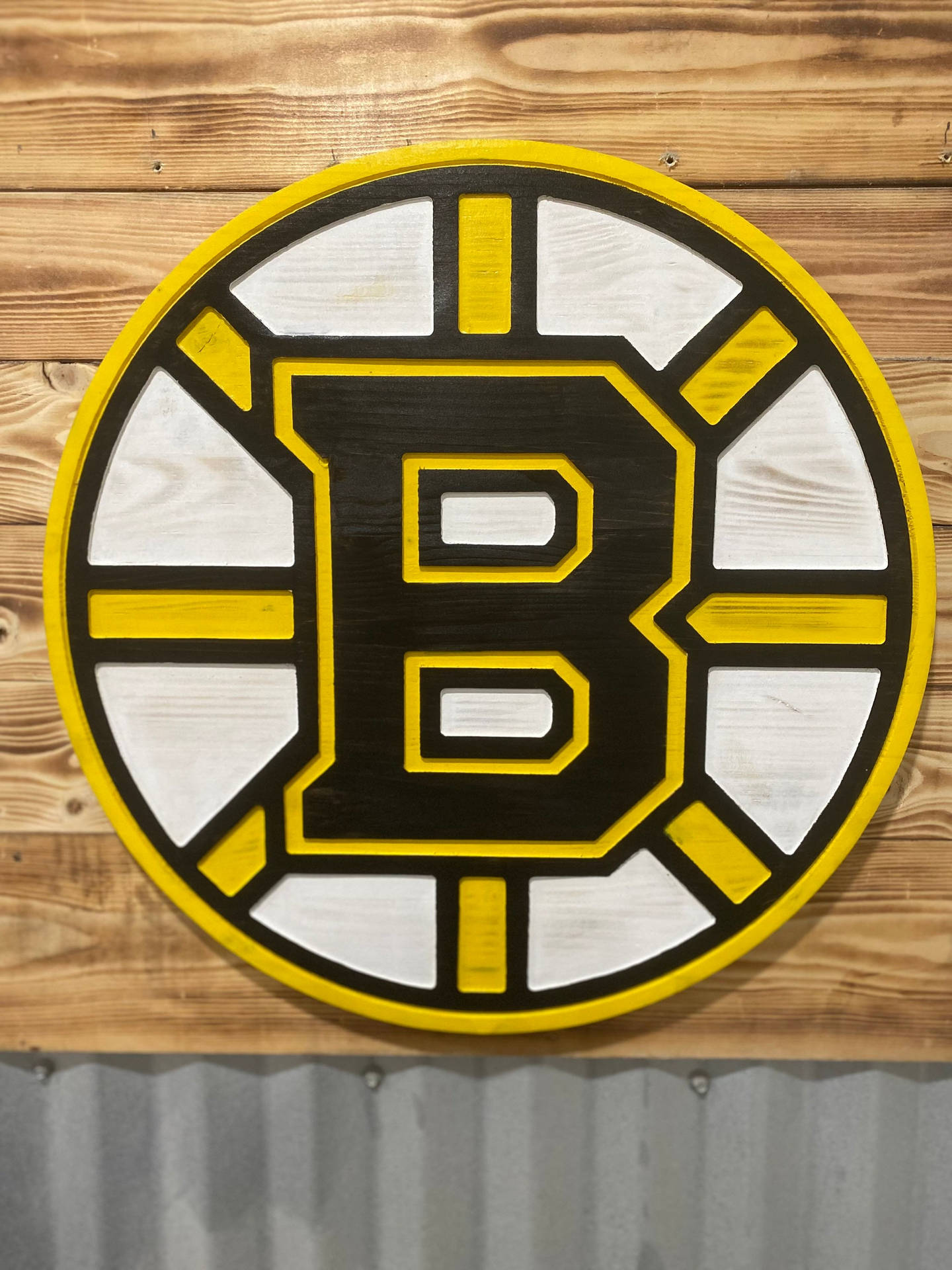 Boston Bruins Logo On Wooden Wall Wallpaper