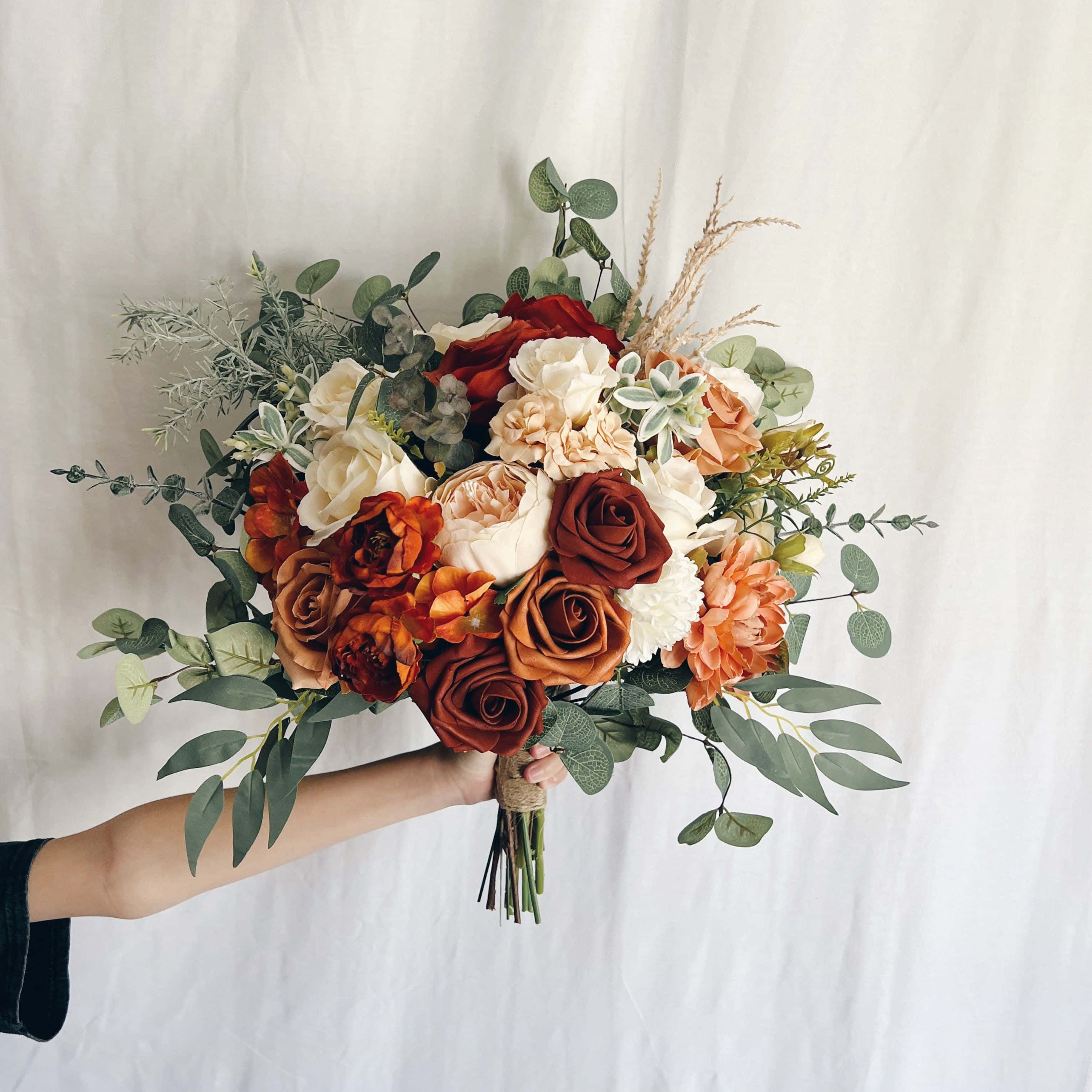 "An Assortment of Beautiful Flowers Skillfully Arranged into a Stunning Bouquet"