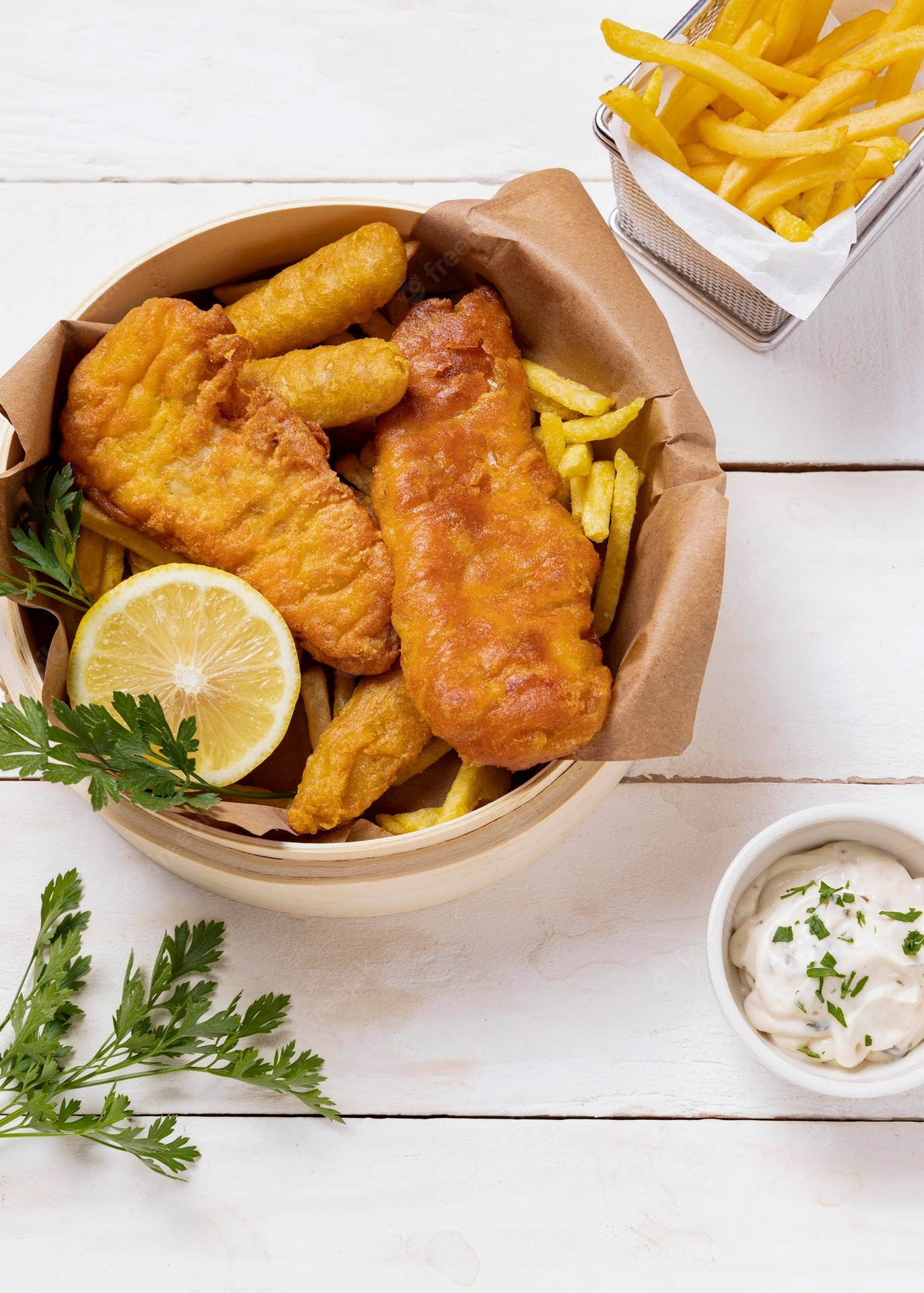 Bowl Of Fish And Chips On A White Table Wallpaper