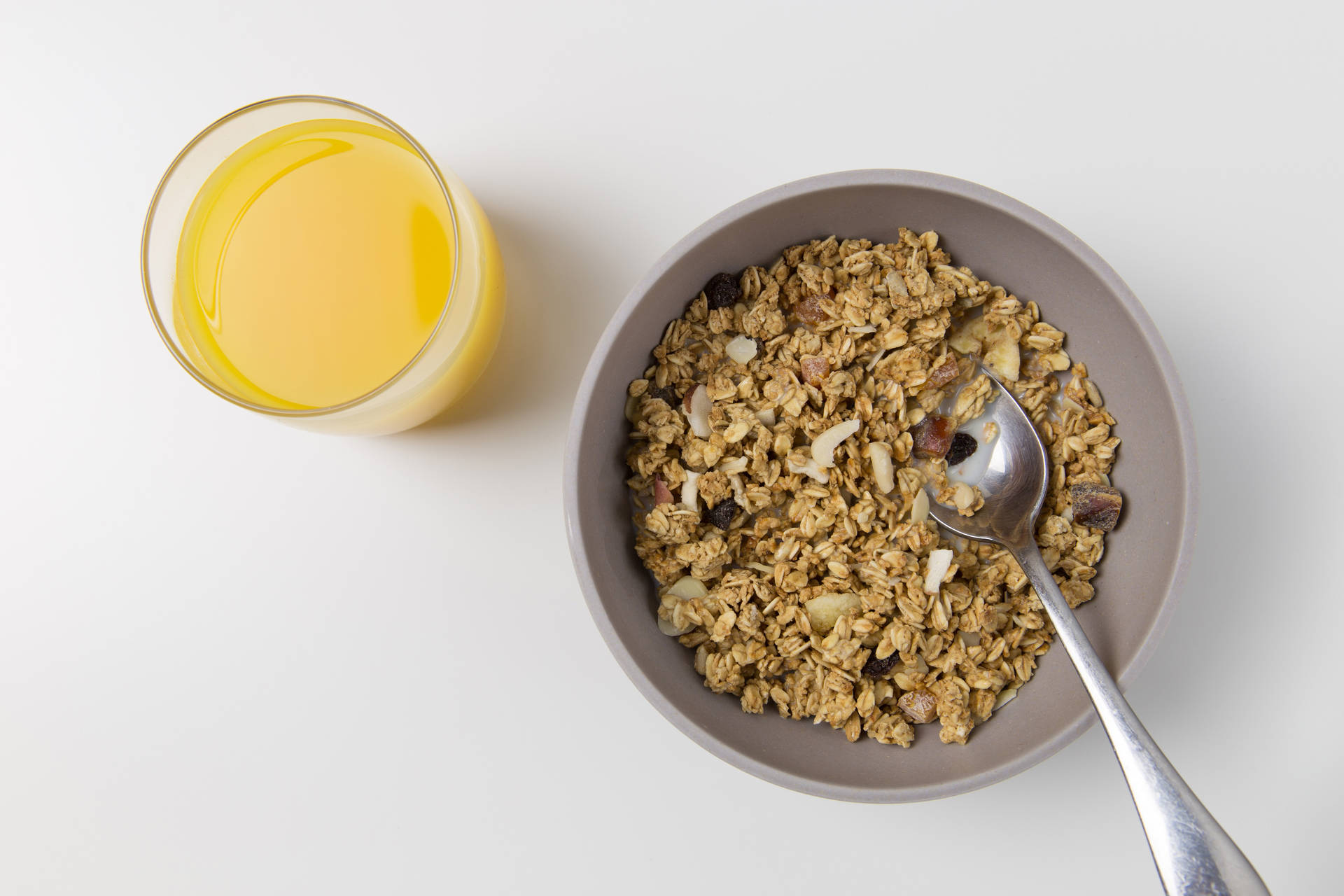 Bowl Of Oatmeal With Orange Juice Wallpaper