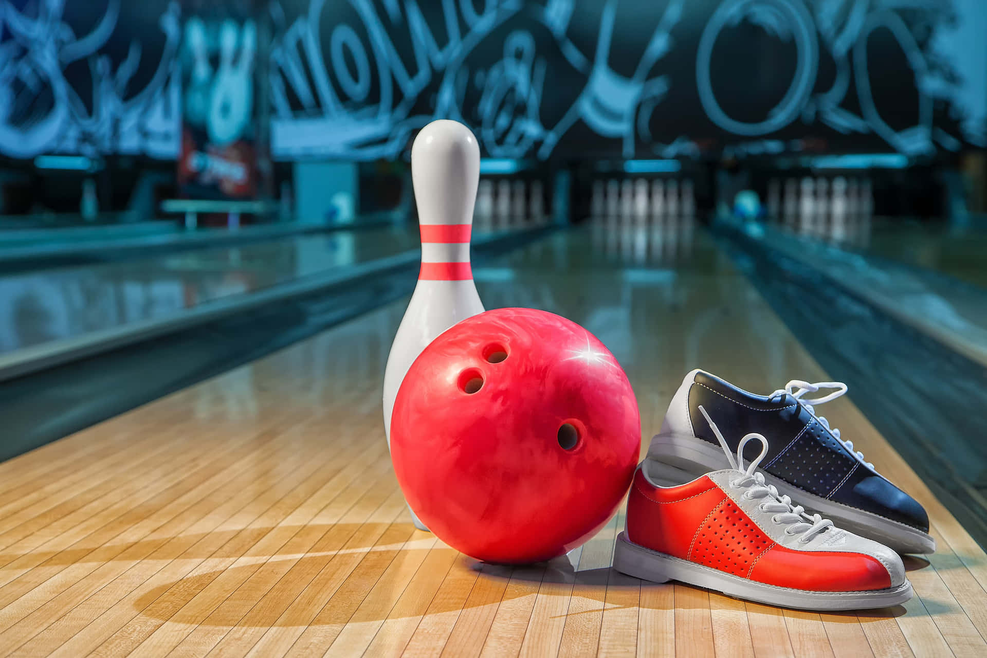 A perfect strike: Bowling ball knocking down pins at a bowling alley