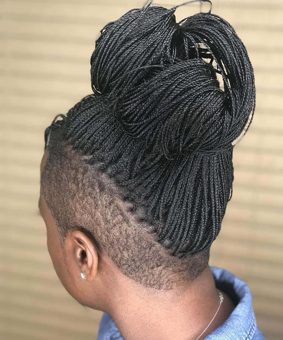 A Woman With Braids In Her Hair