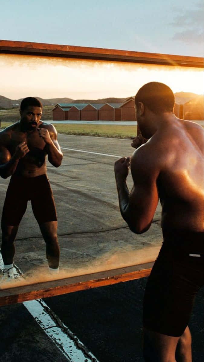 Boxers Facing Offat Sunset Wallpaper