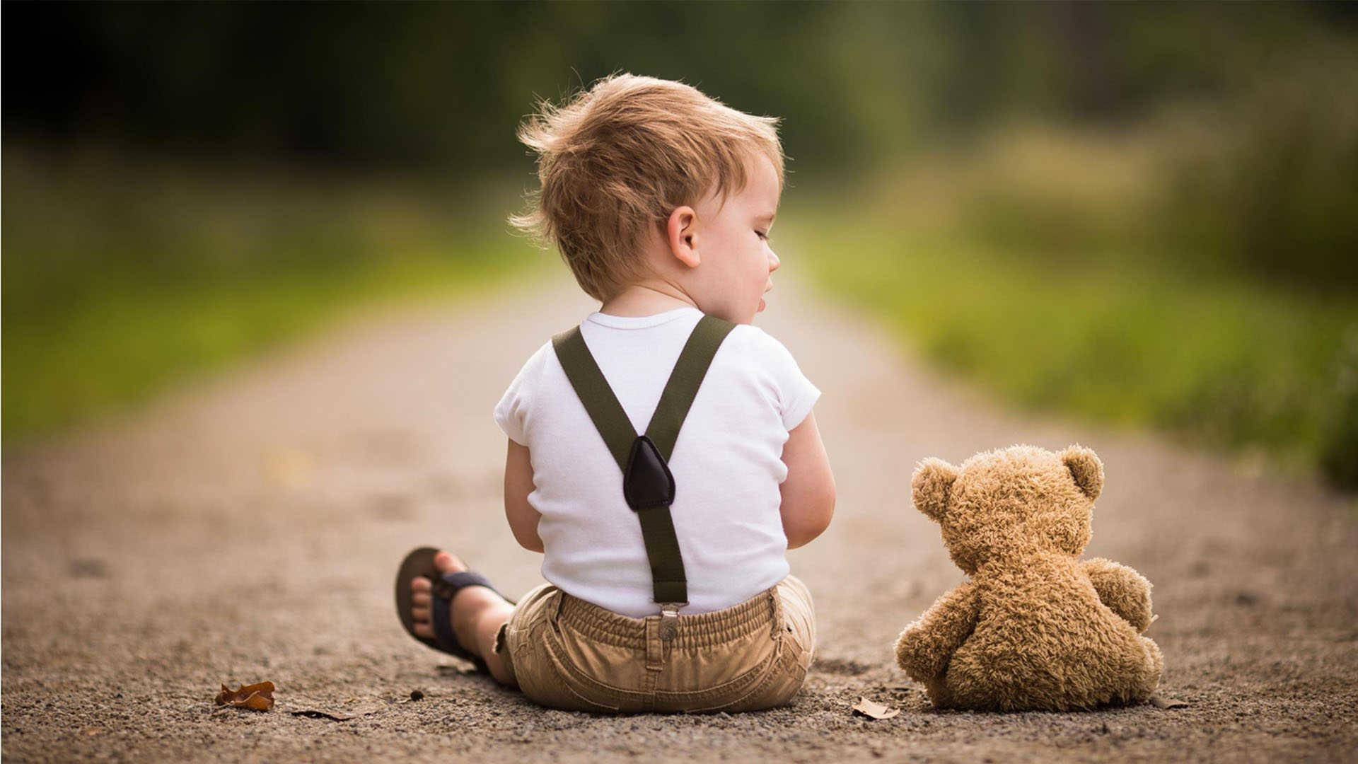 Boy Child With Teddy Bear On The Road Wallpaper
