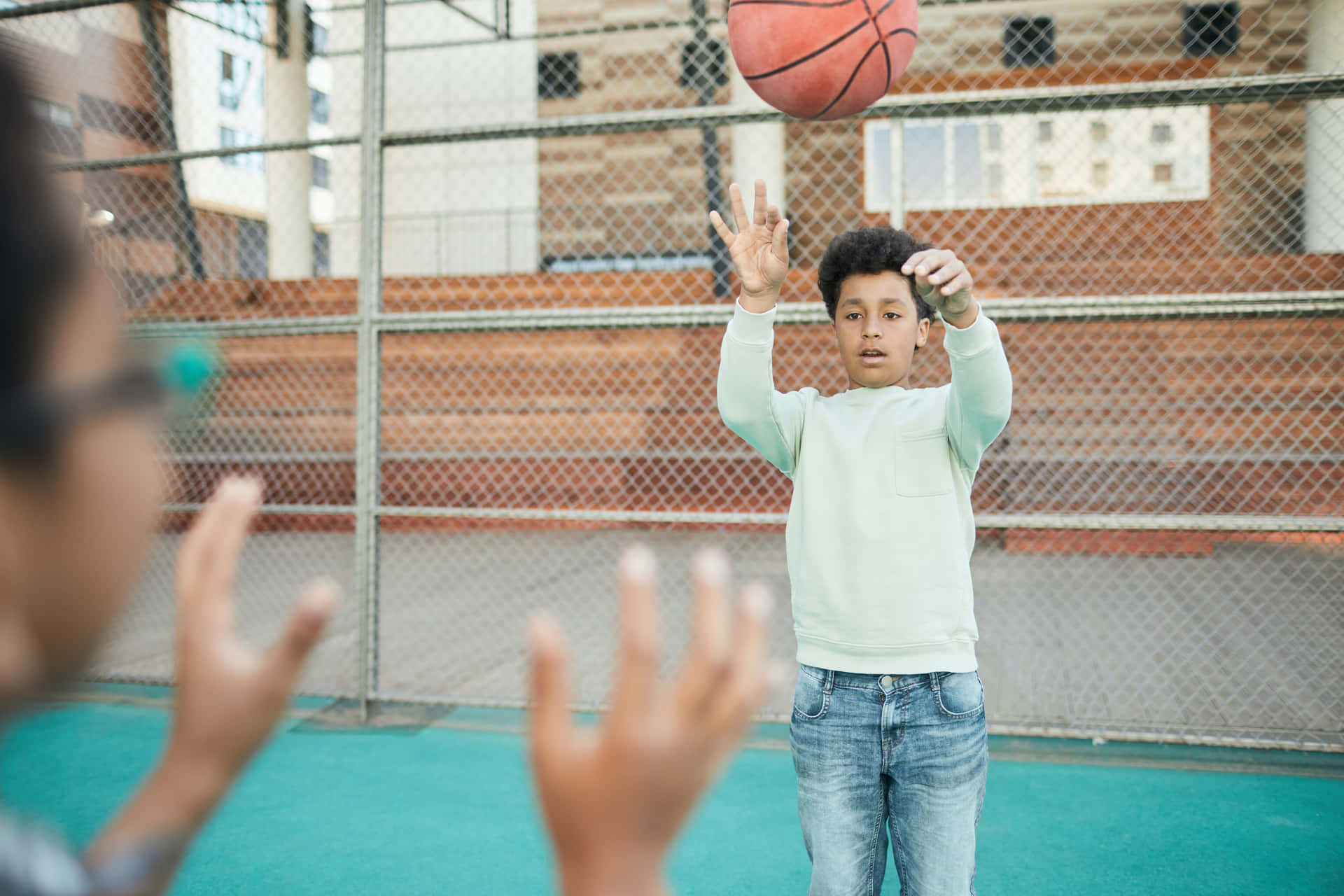 Boy Passing A Basketball Wallpaper