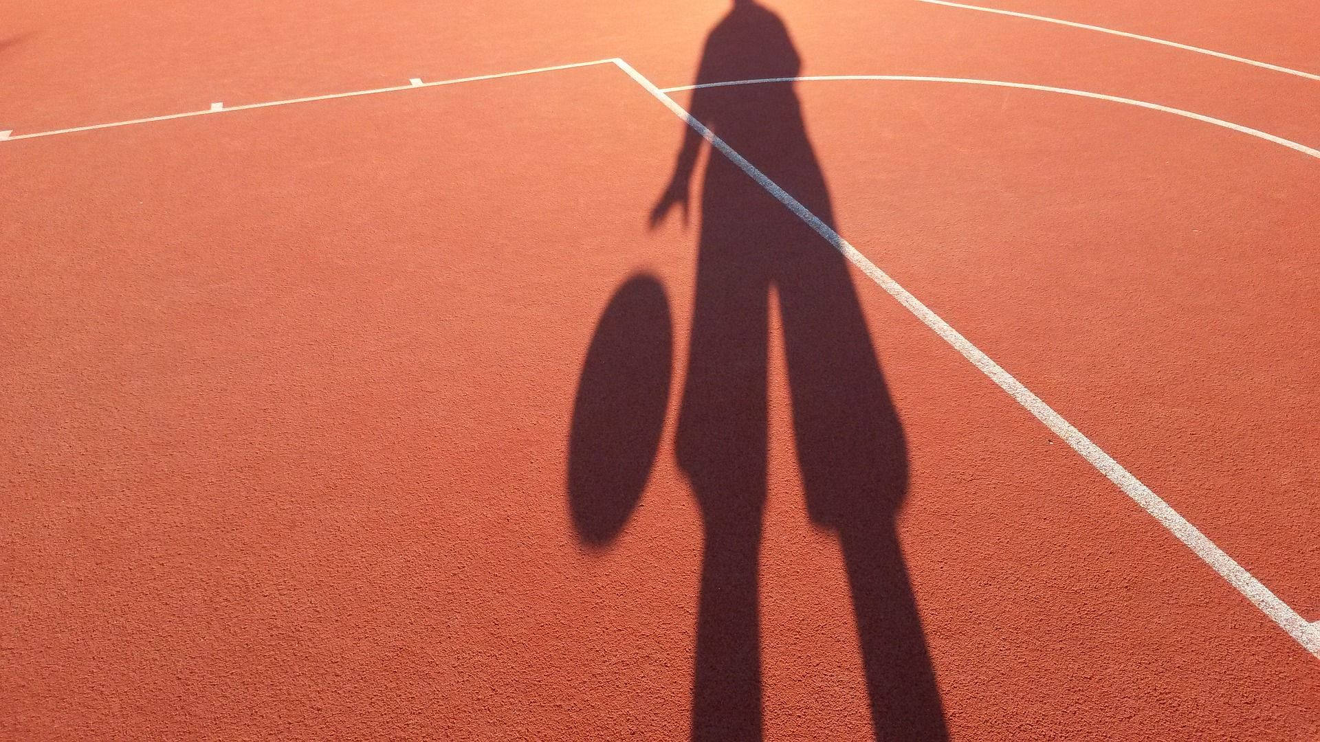 Boy Shadow In A Basketball Court